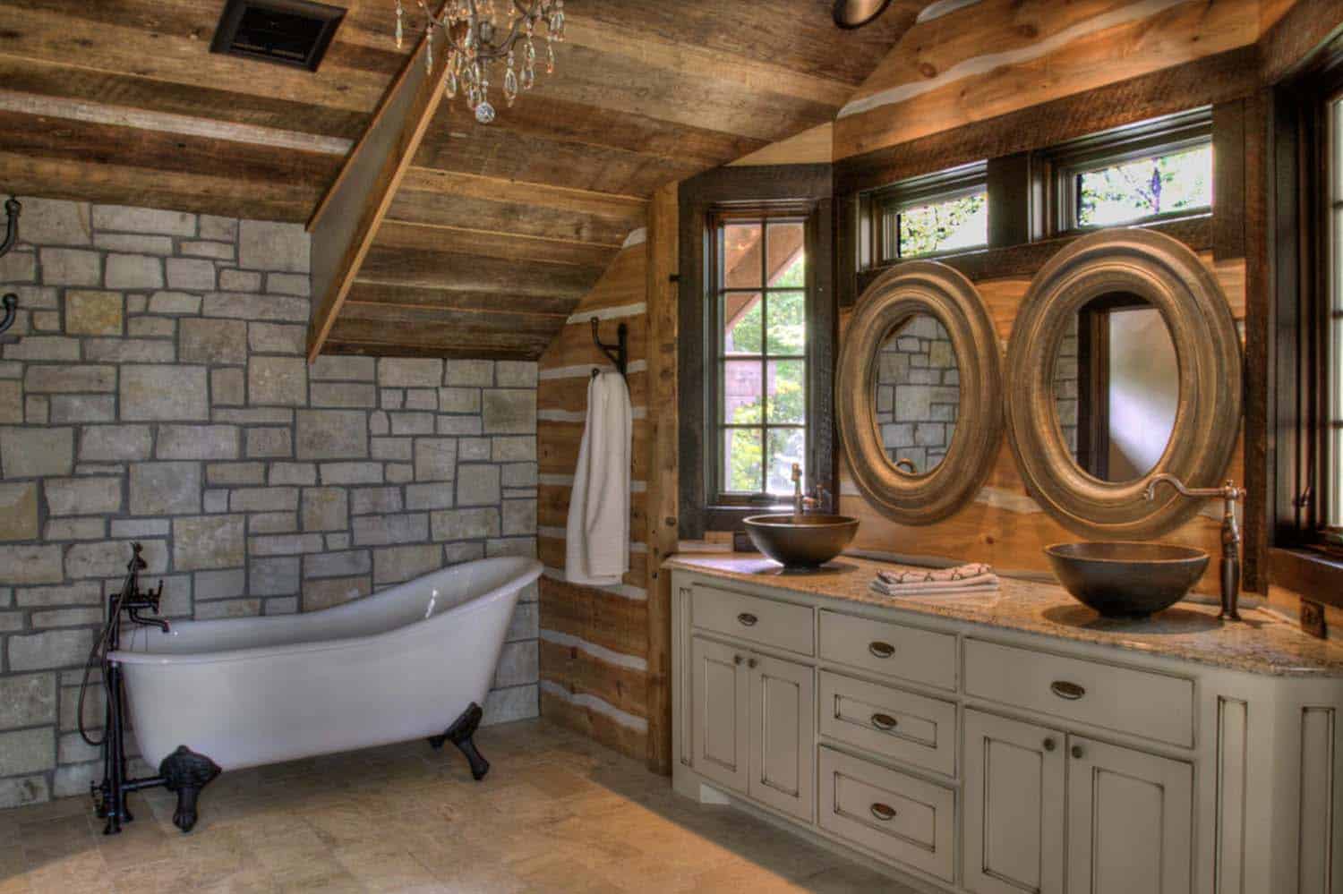 rustic bathroom with a vanity and clawfoot tub