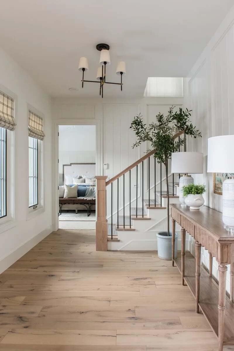 traditional farmhouse style home entry with a console table
