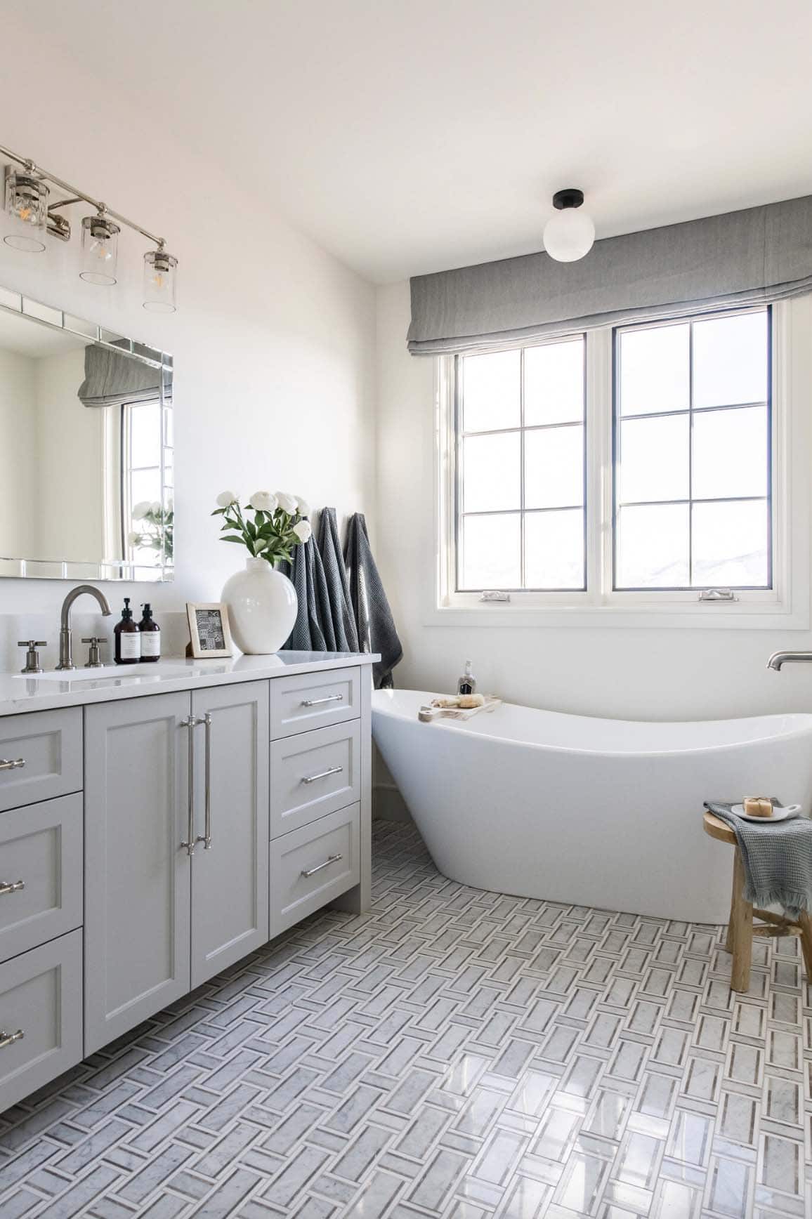 traditional farmhouse style bathroom with a freestanding tub