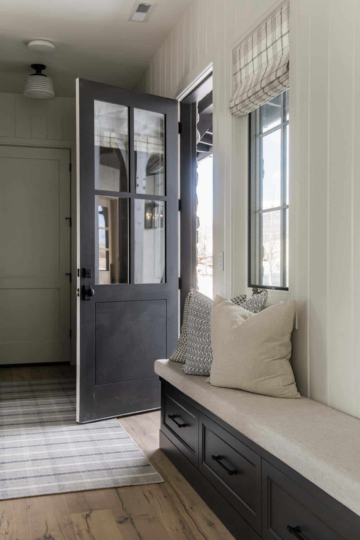 traditional farmhouse style mudroom entry with a bench