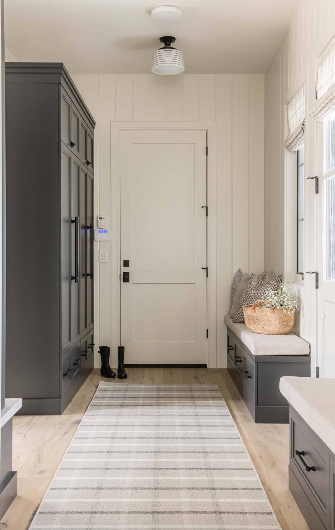 traditional farmhouse style mudroom with a bench