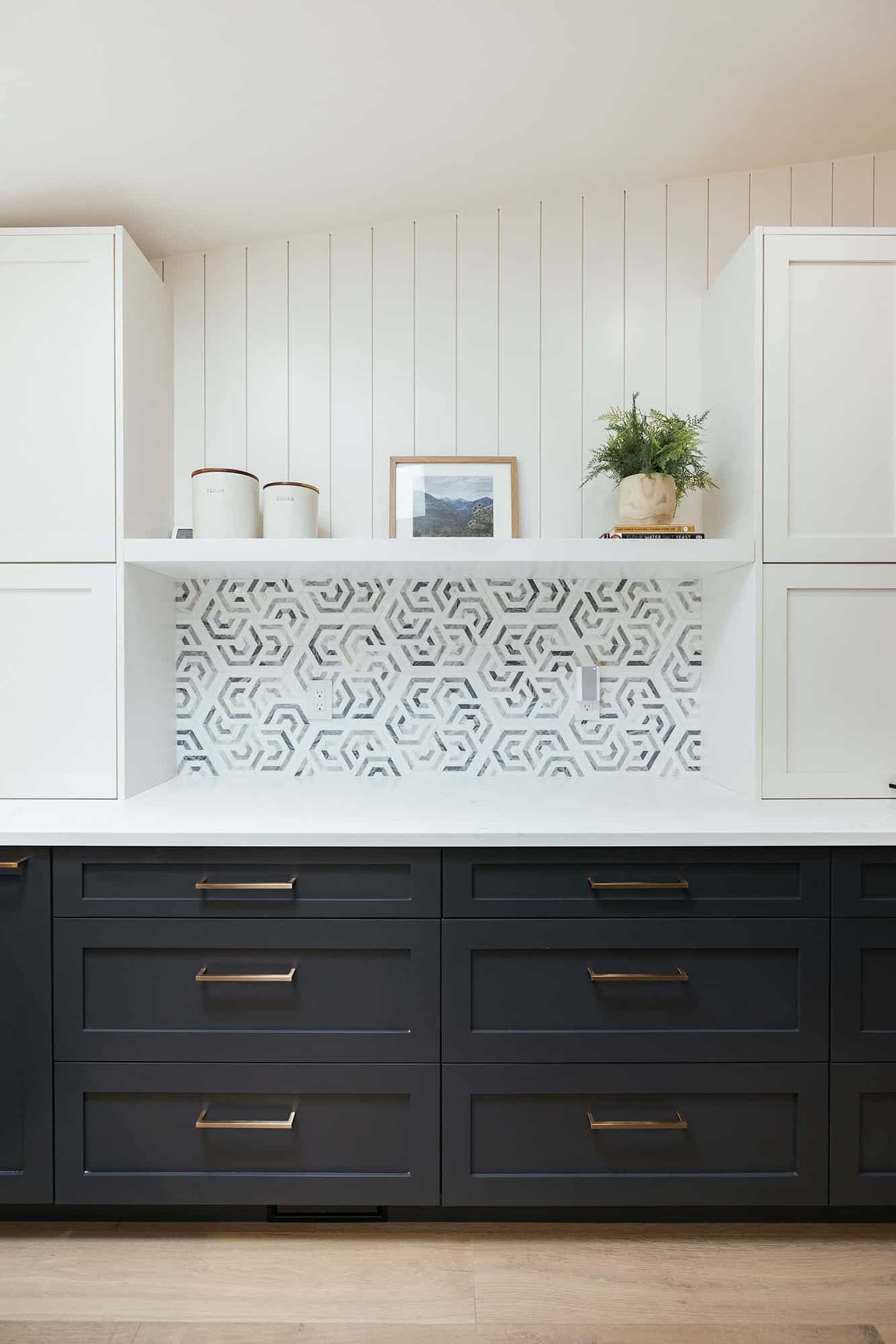 modern kitchen with open shelves and a pattern backsplash tile