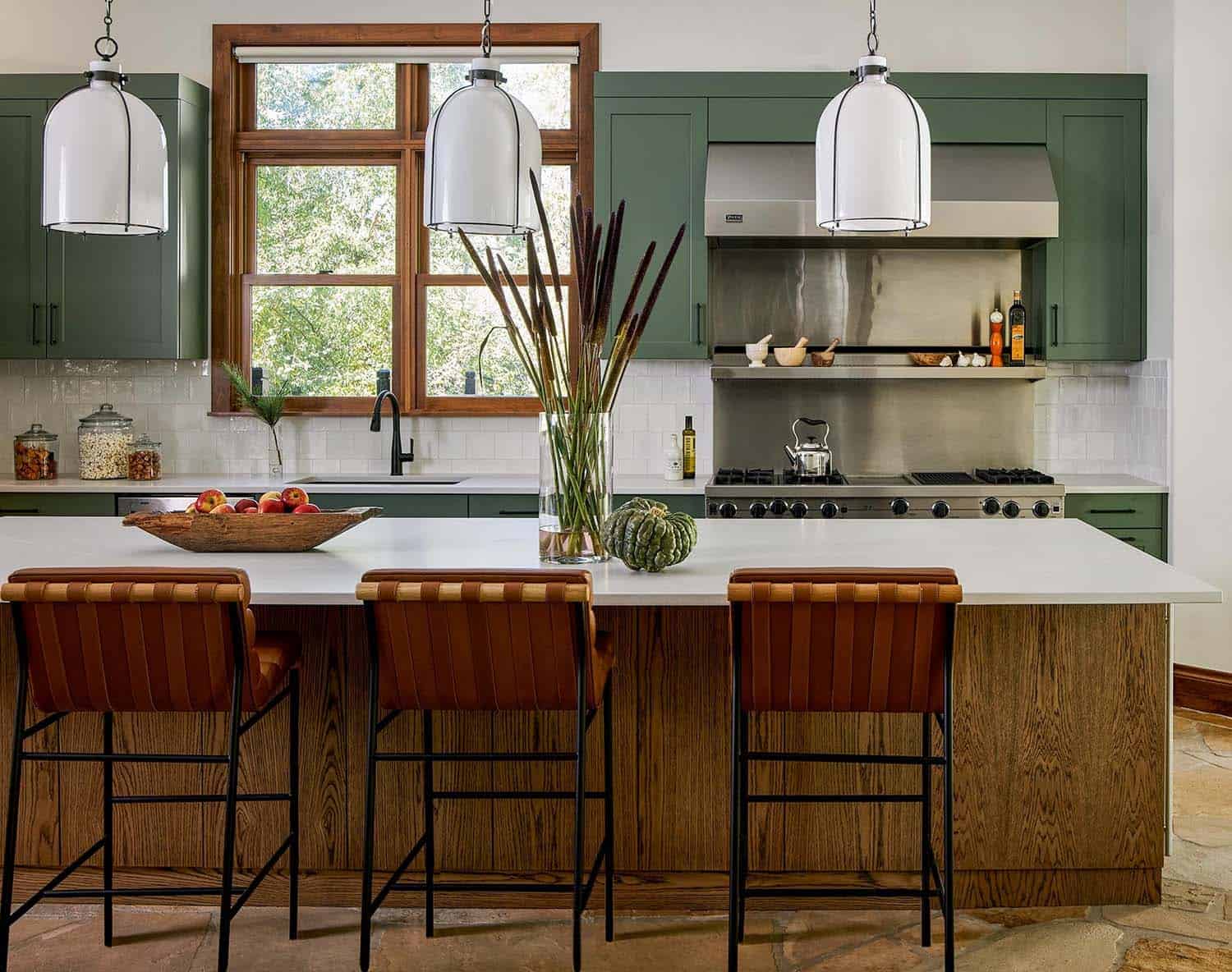 contemporary chef kitchen with sage green and wire brushed oak cabinets