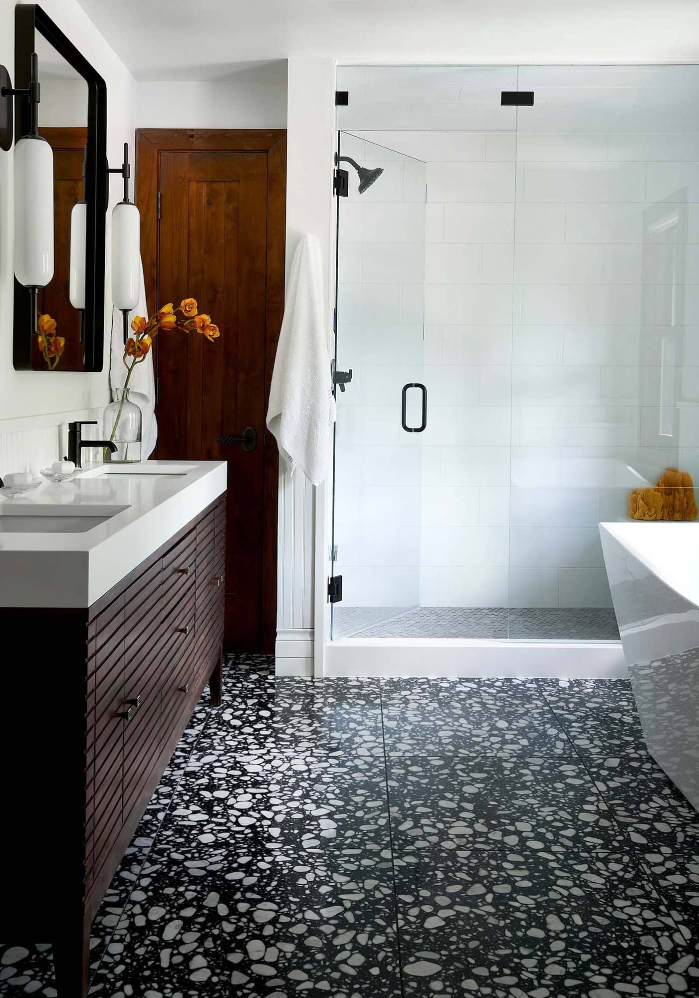 black and white bathroom with terrazzo flooring