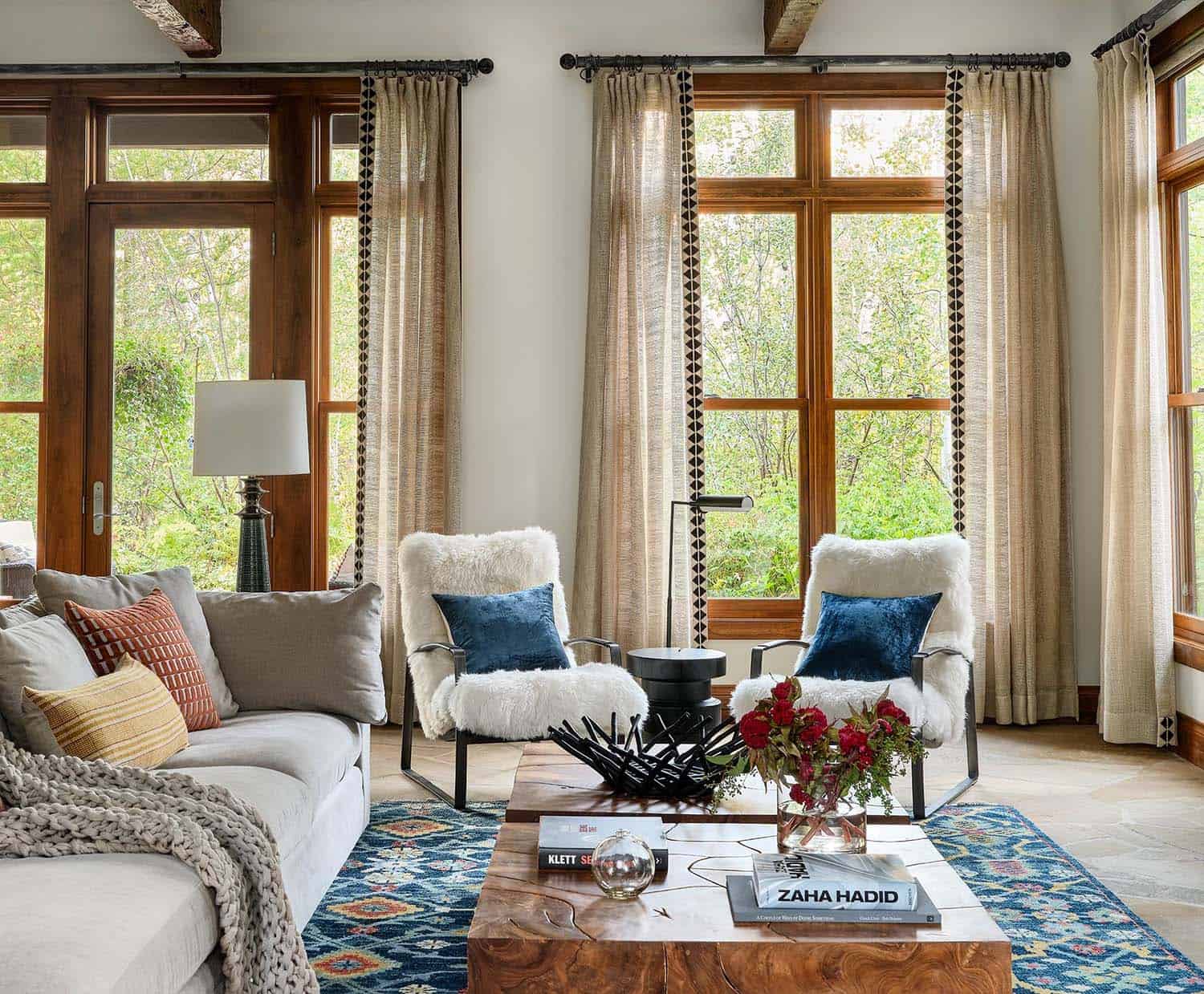 neutral rustic contemporary living room with patterned rugs