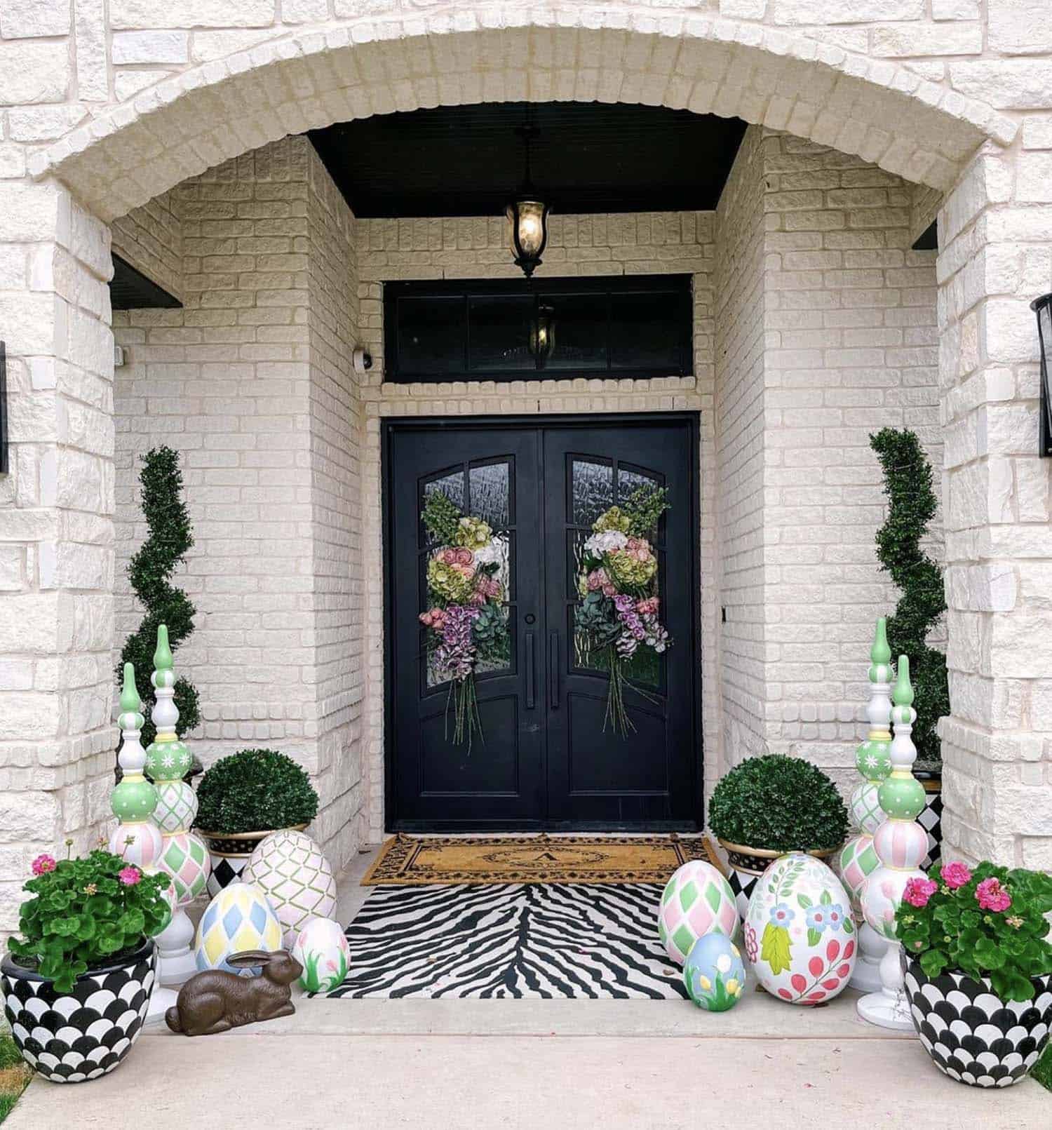 front porch decorated for spring with soft pastel accents