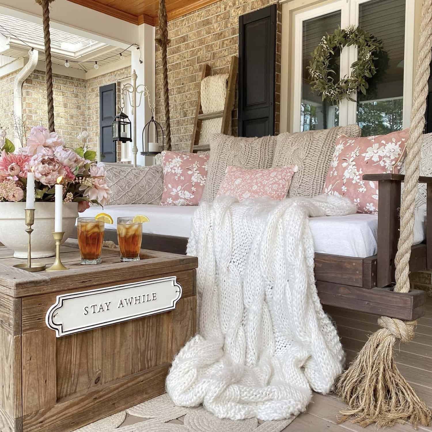 front porch swing decorated for spring