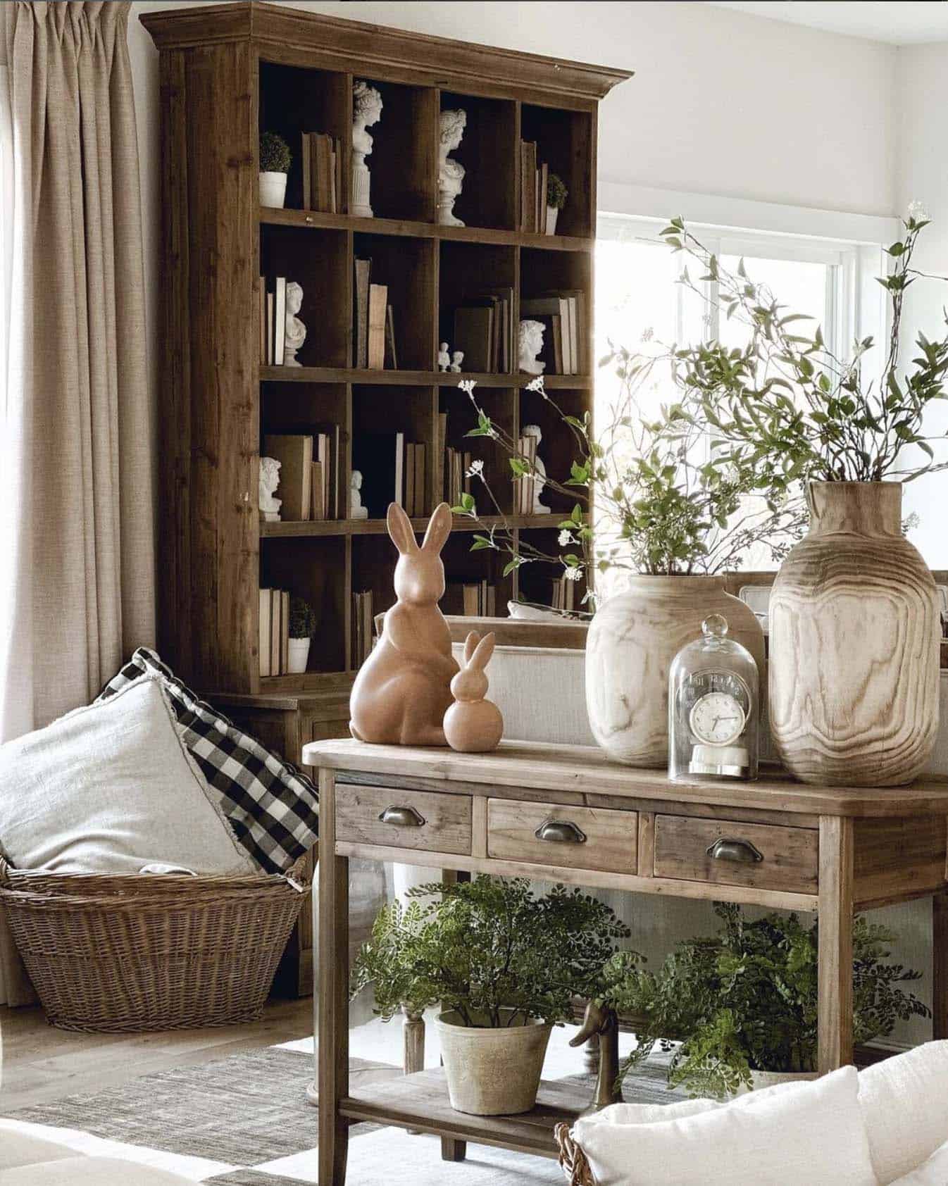 living room decorated for spring with whites, woods and greenery