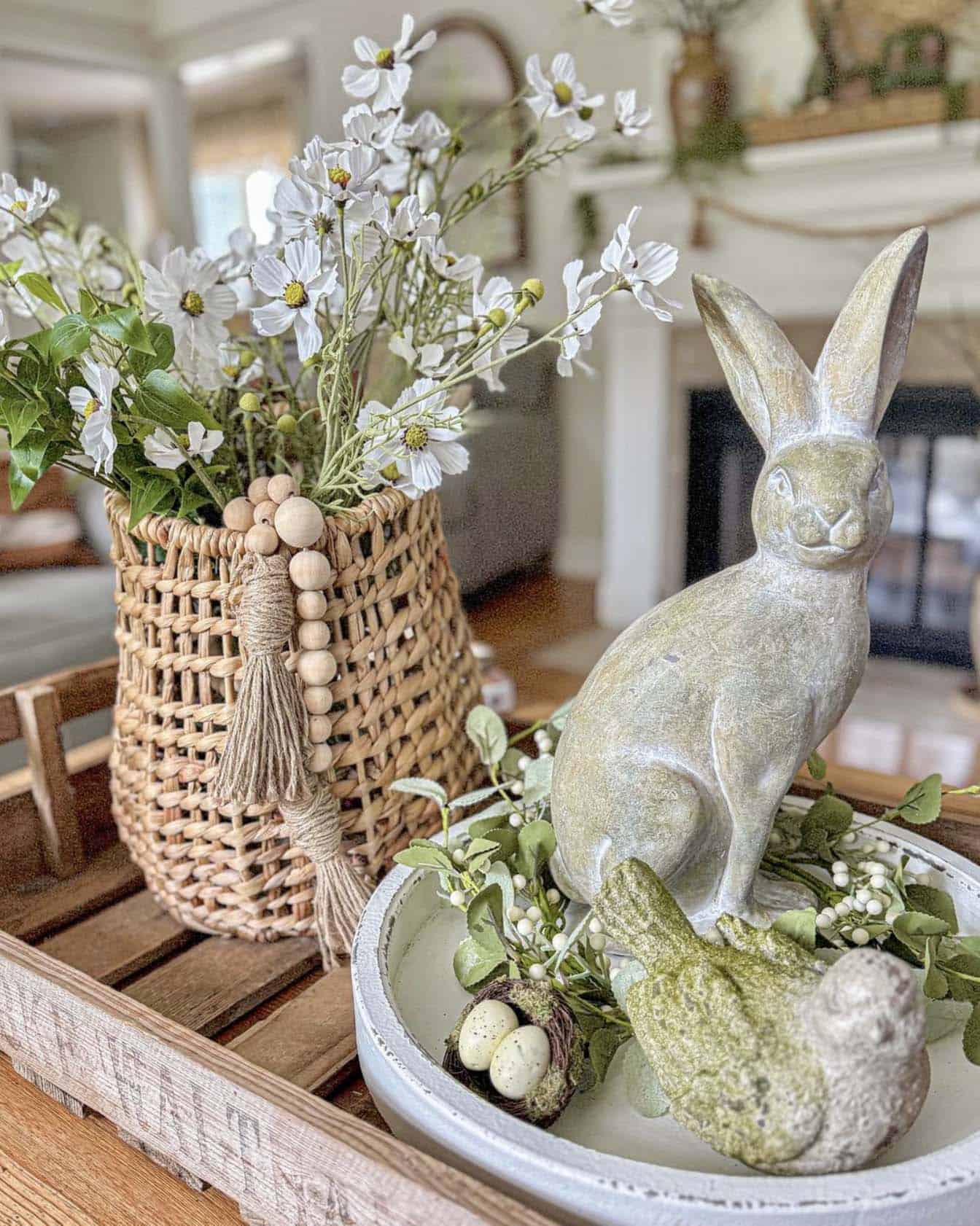 spring vignette with a bunny and vase of faux flowers on a tray