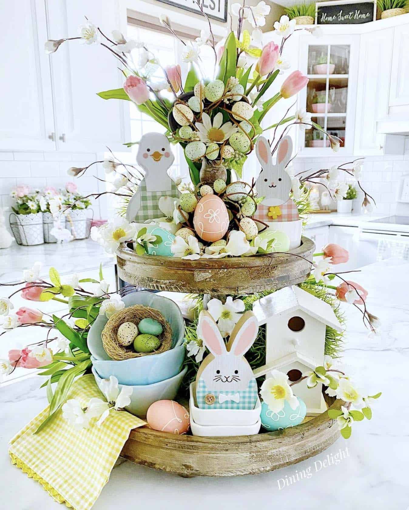 tiered tray on the kitchen countertop decorated for spring