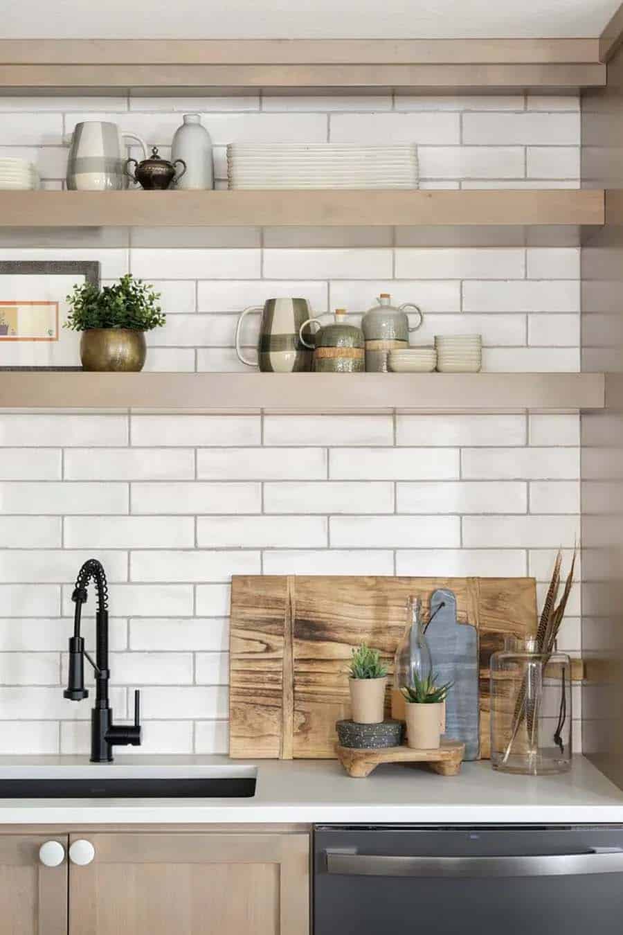 scandinavian style kitchen with open shelves and subway tile backsplash