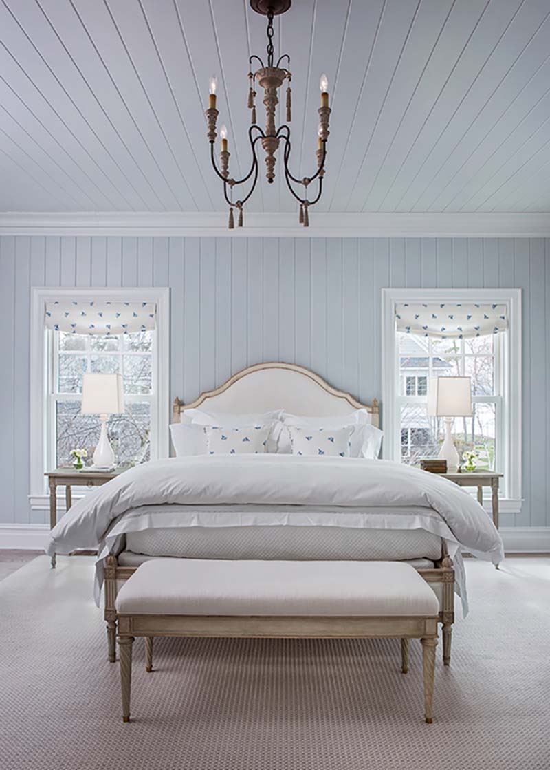 traditional coastal style bedroom with shiplap walls
