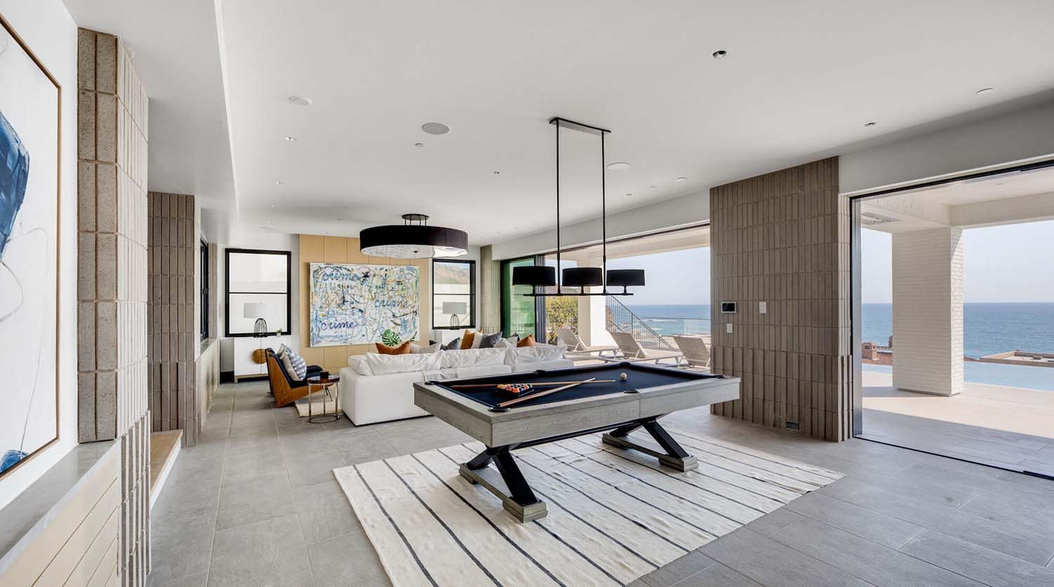 coastal contemporary family room with a billiards table