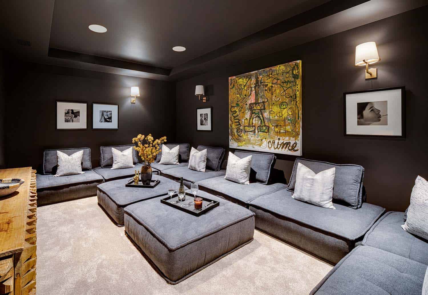 coastal contemporary home theater with black walls and ceiling