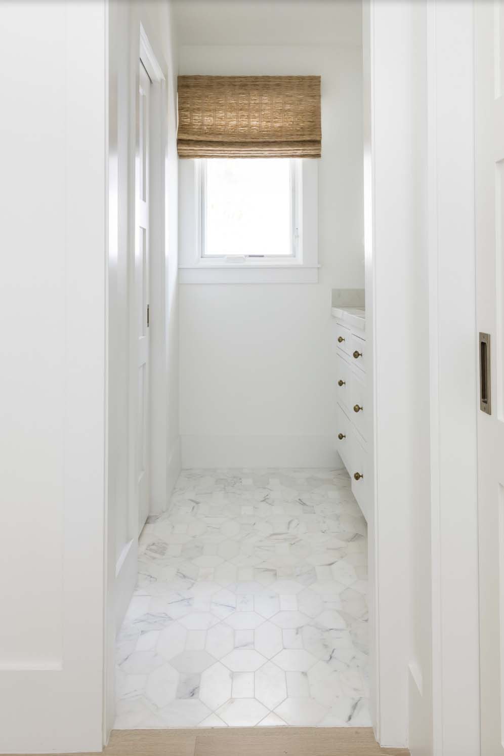 coastal style hallway into the bathroom
