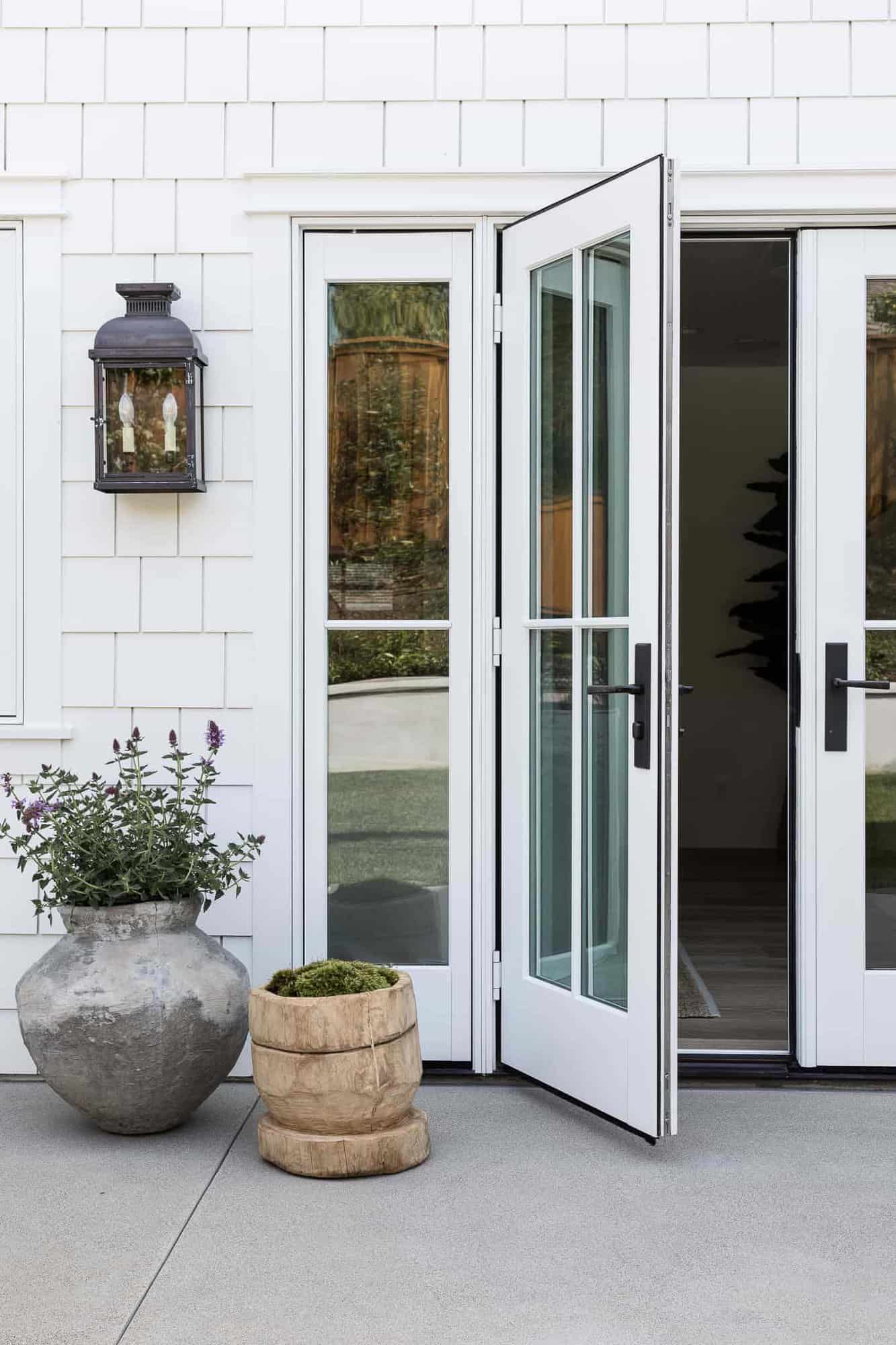 coastal style home exterior with French doors