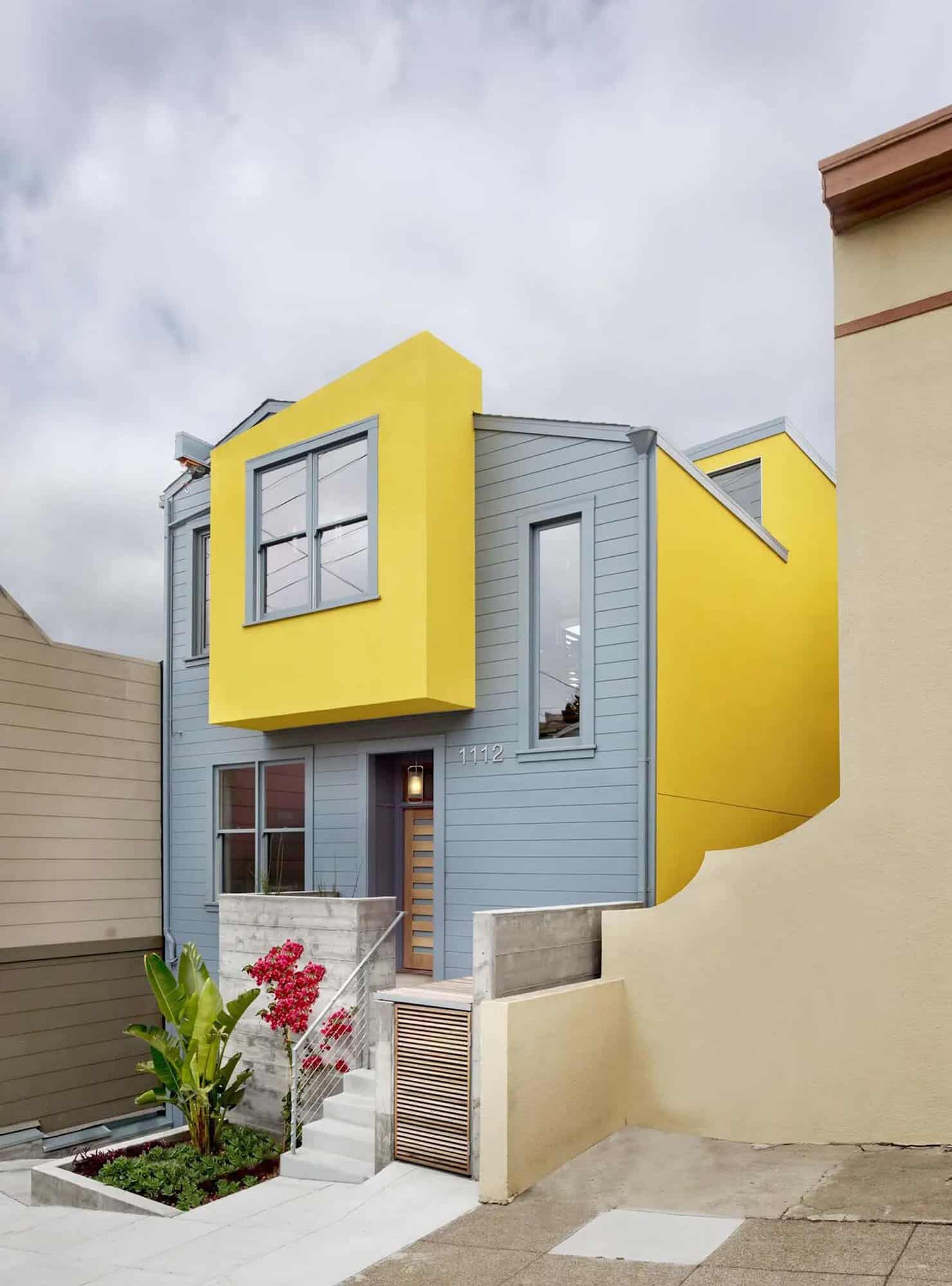 contemporary home exterior with a gray and yellow facade