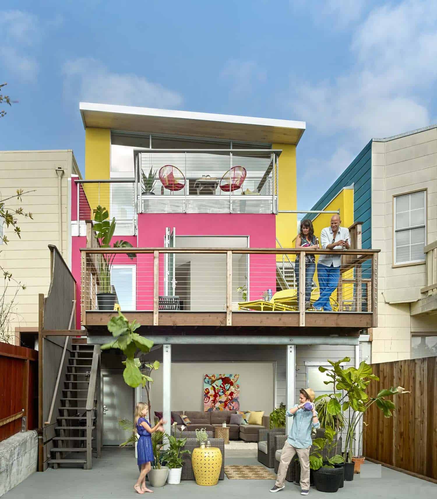 contemporary home exterior with a yellow and pink facade