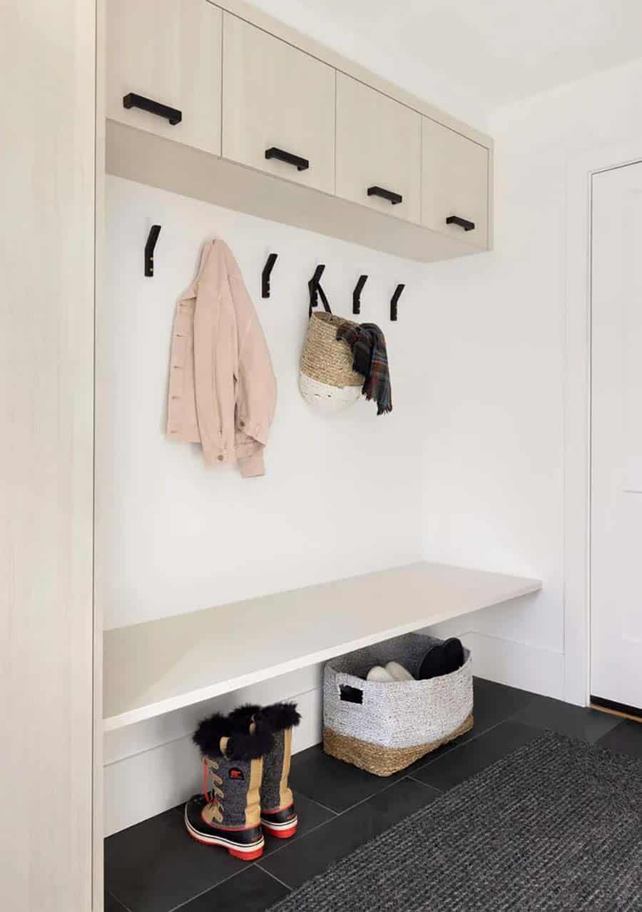 contemporary mudroom with a bench and storage cabinets
