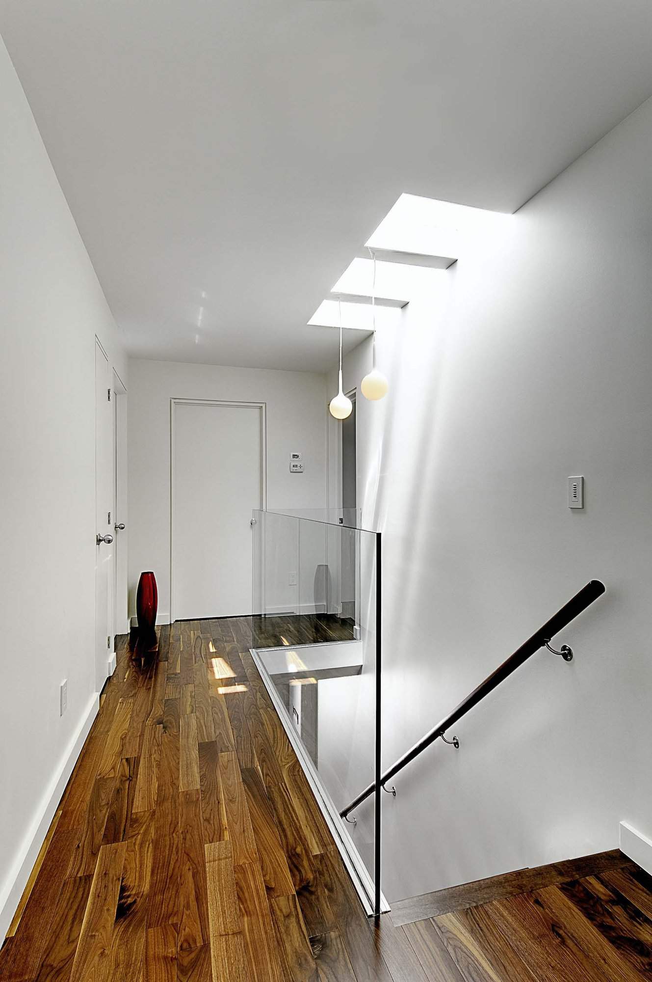 contemporary staircase and upstairs hallway