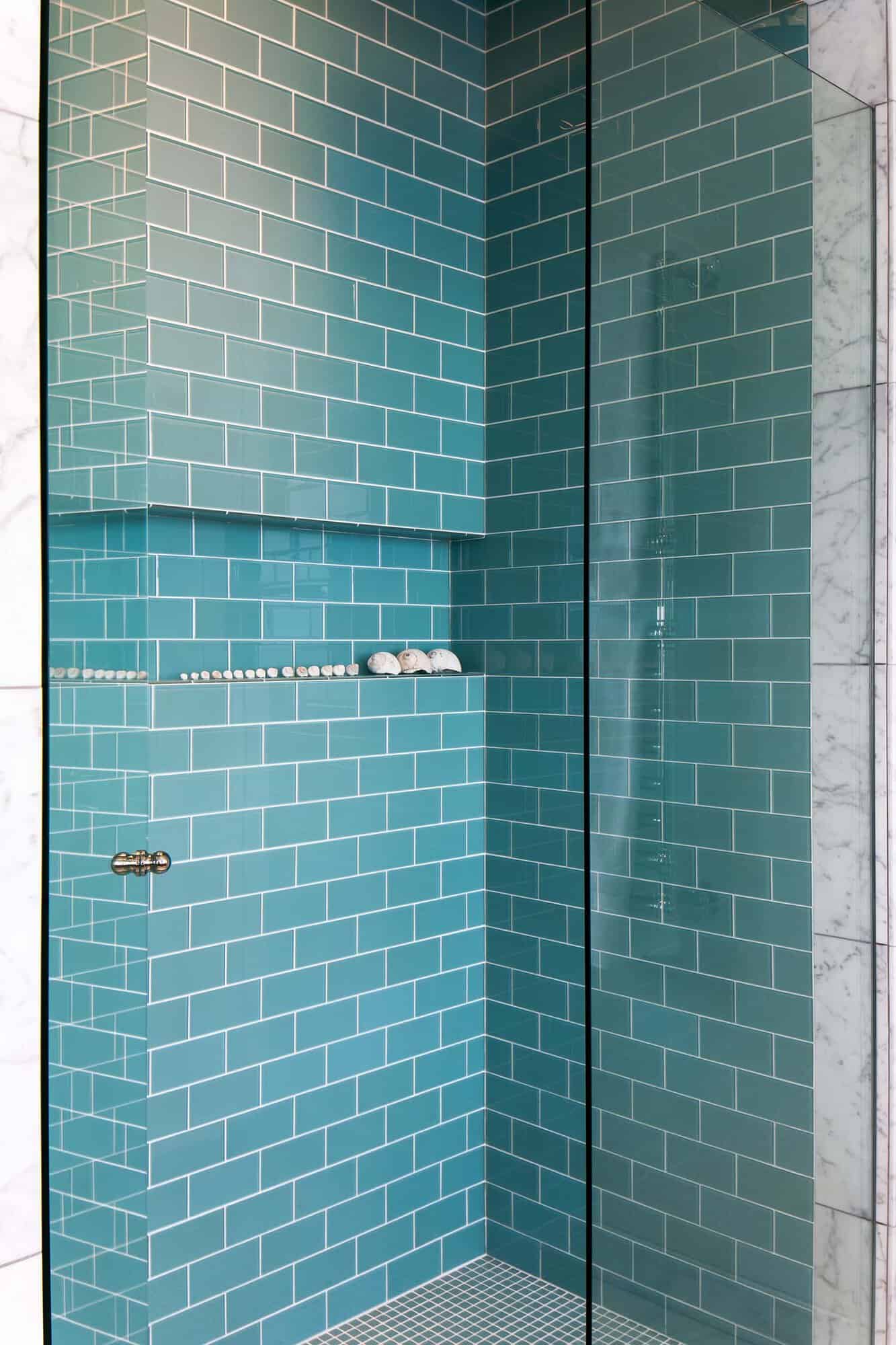 contemporary farmhouse bathroom shower with blue tiles
