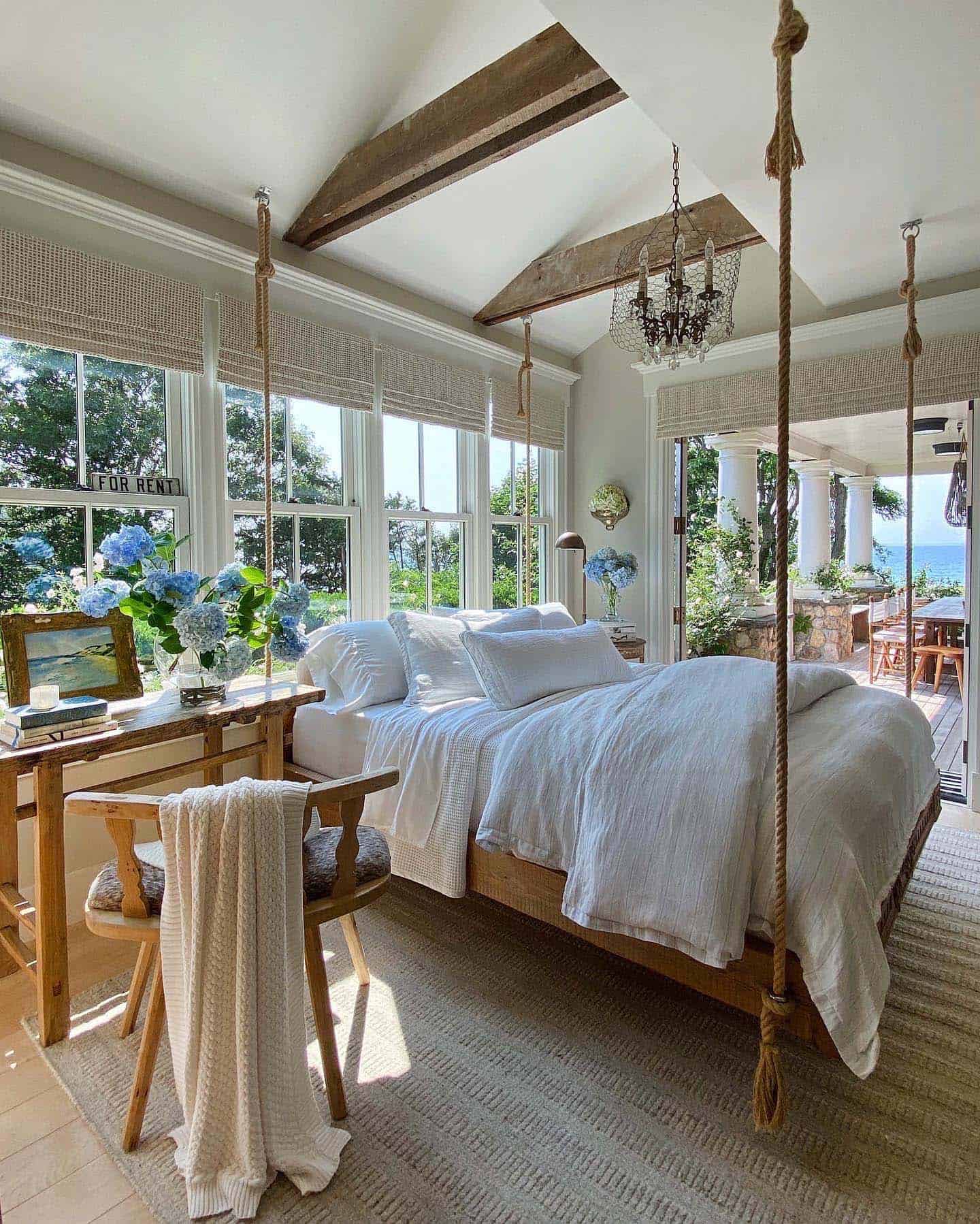 cape cod style bedroom with French doors leading to a deck
