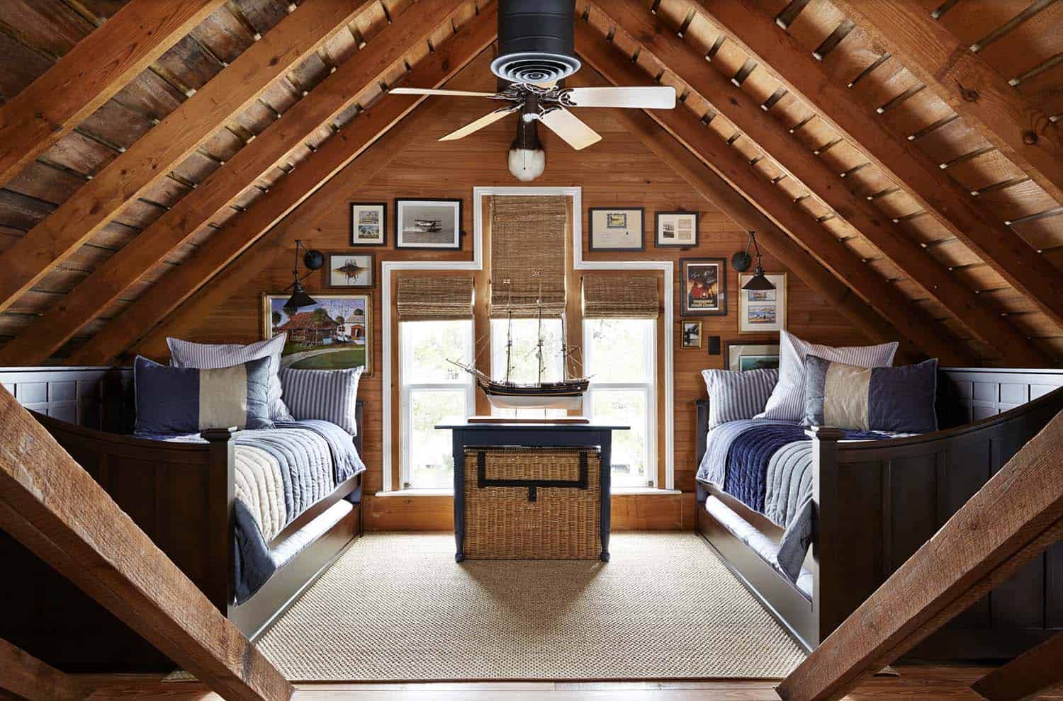 beach-style guest bedroom with built-in beds and a vaulted ceiling