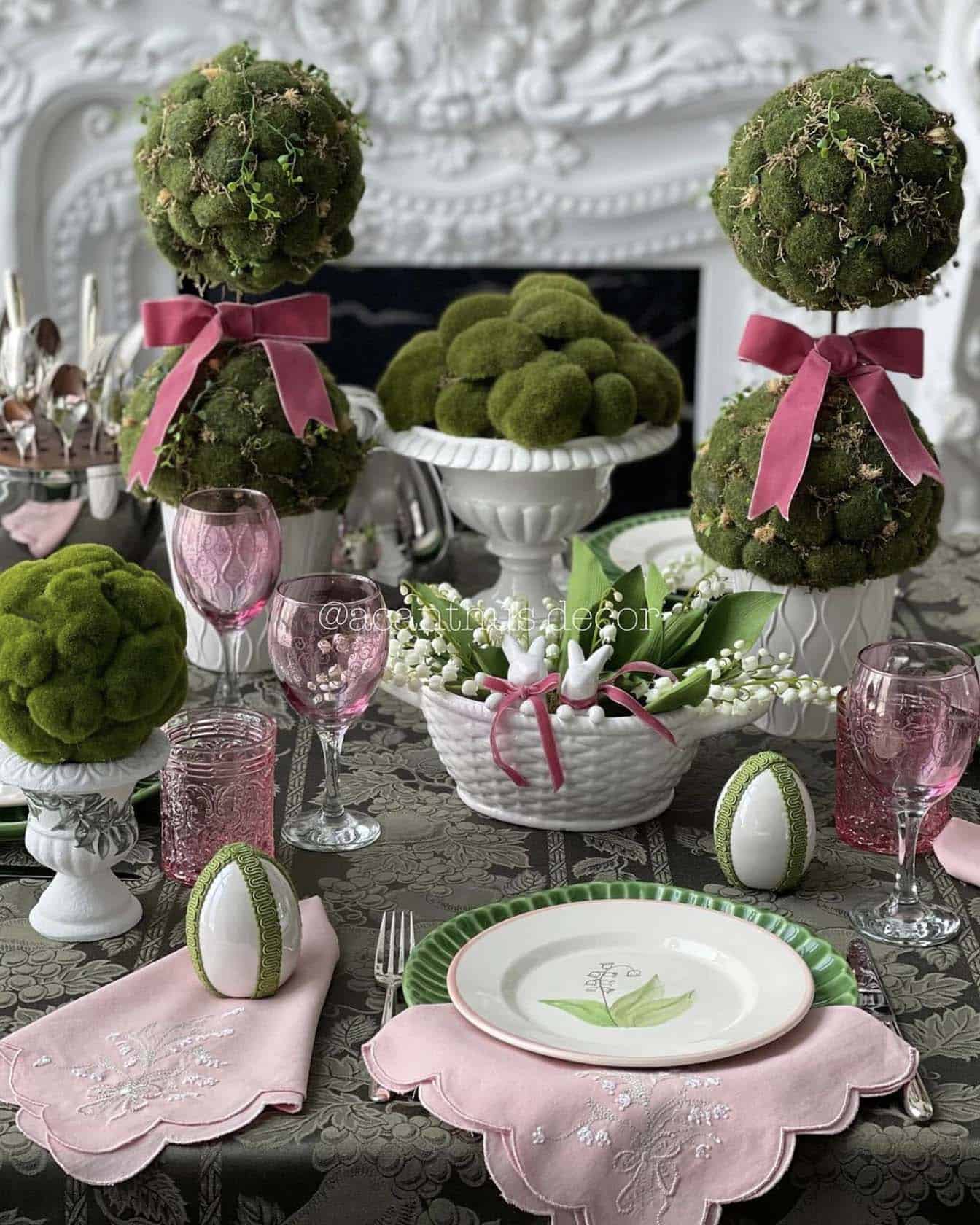Easter table setting with topiaries and ceramic bowls with moss