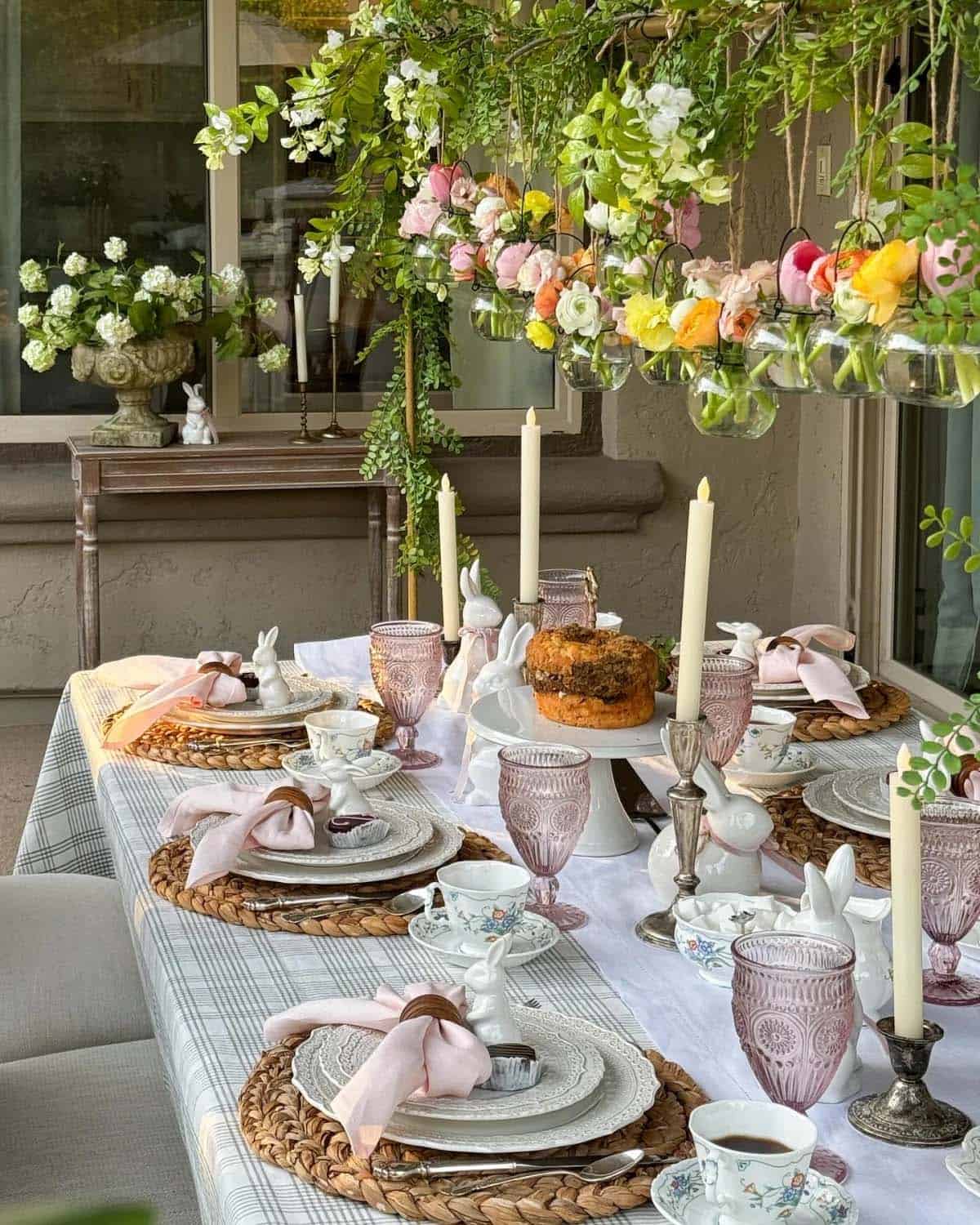 easter alfresco dining with flowers, candles and pink napkins 