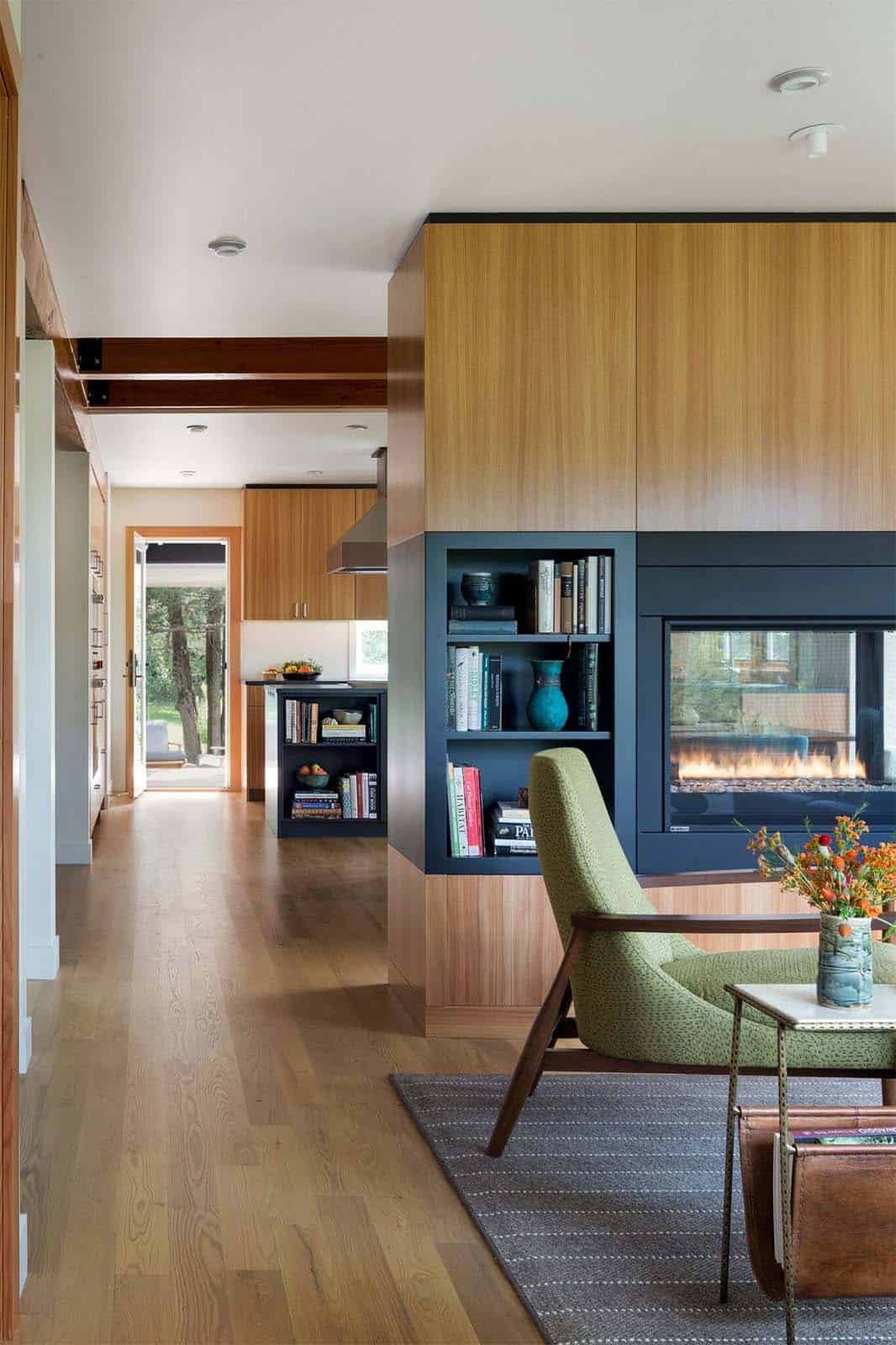 midcentury modern living room with a dual-sided fireplace