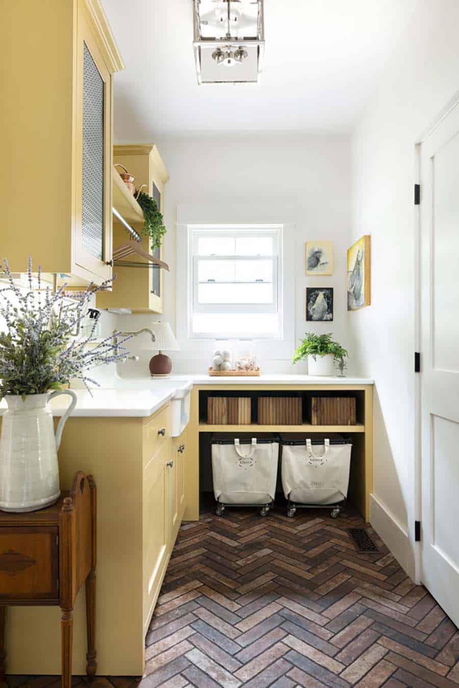 contemporary laundry room with yellow cabinets