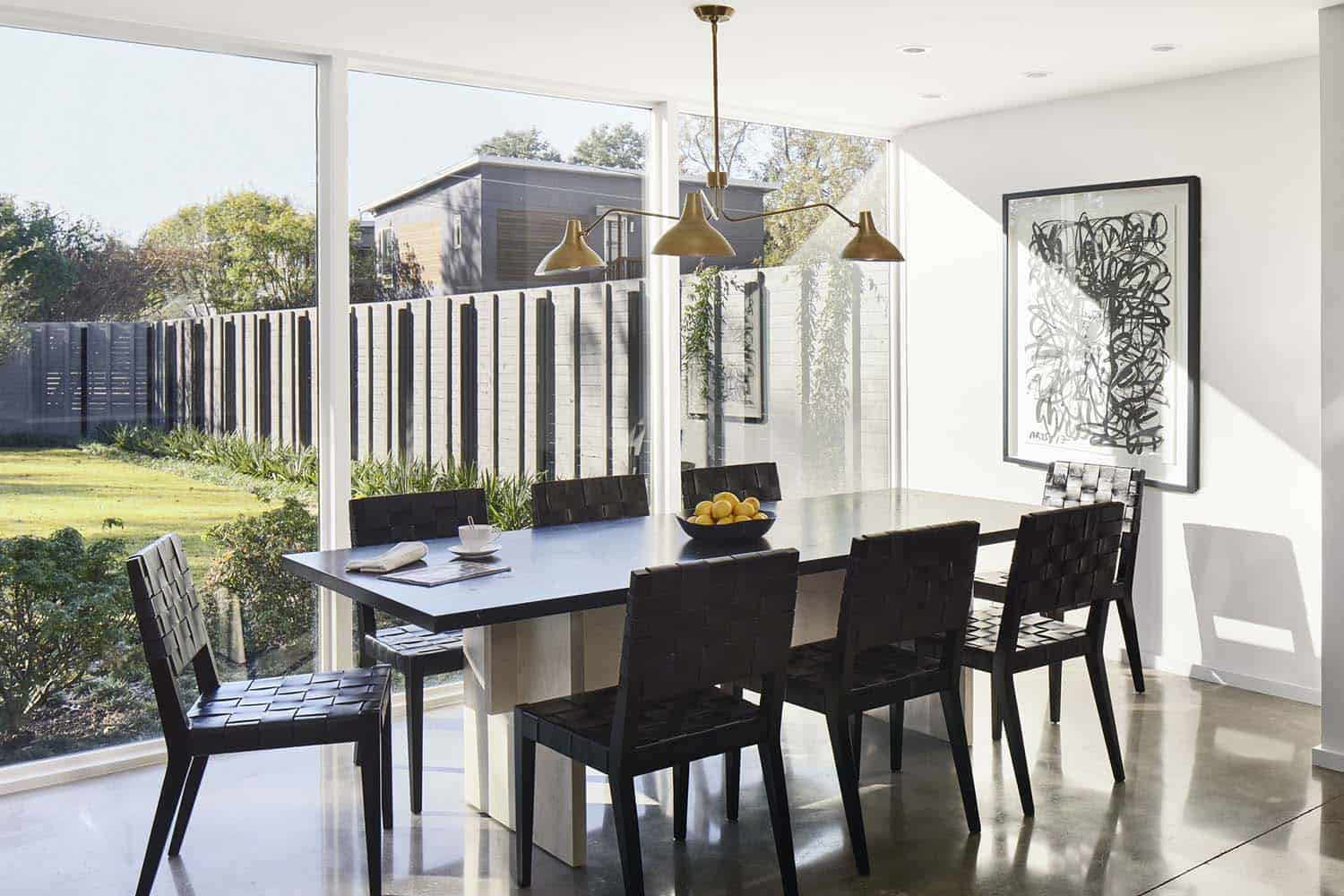 modern dining room with sliding glass doors out to the patio