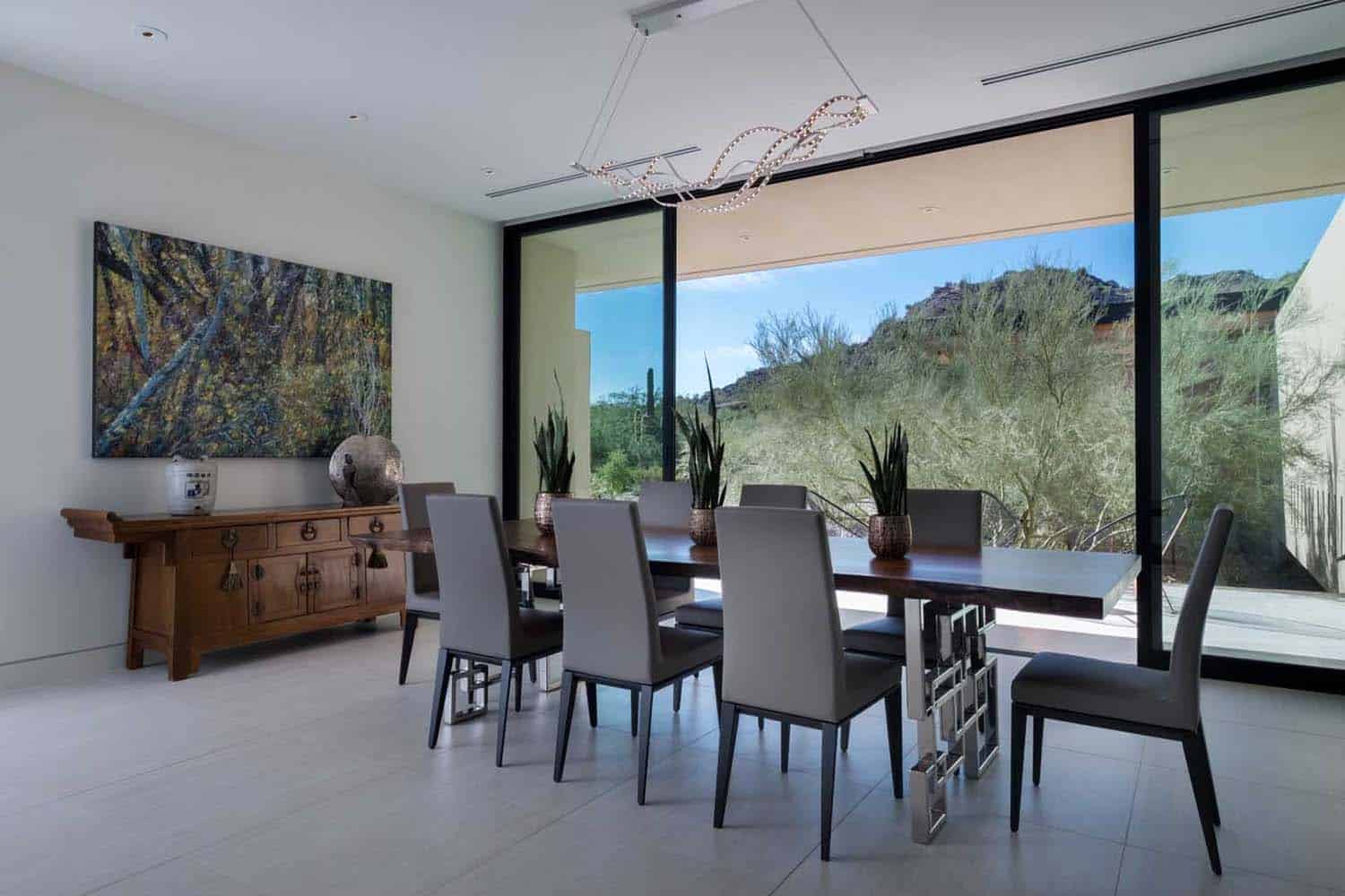 modern dining room with a sliding glass wall