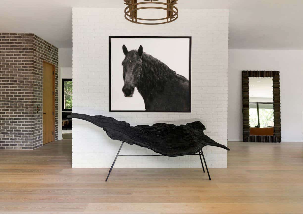 modern lake house entry with horse wall art