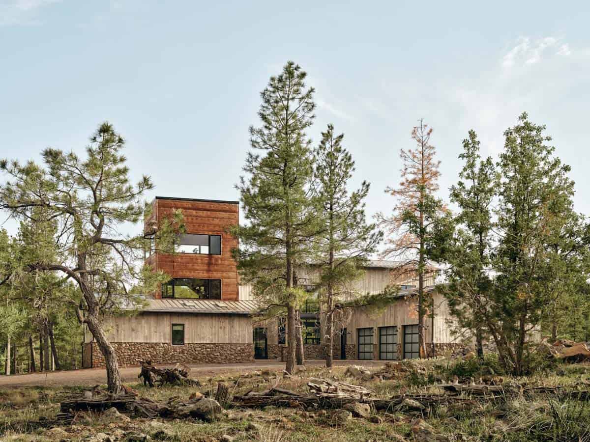 mountain modern house with a tower in a ponderosa forest