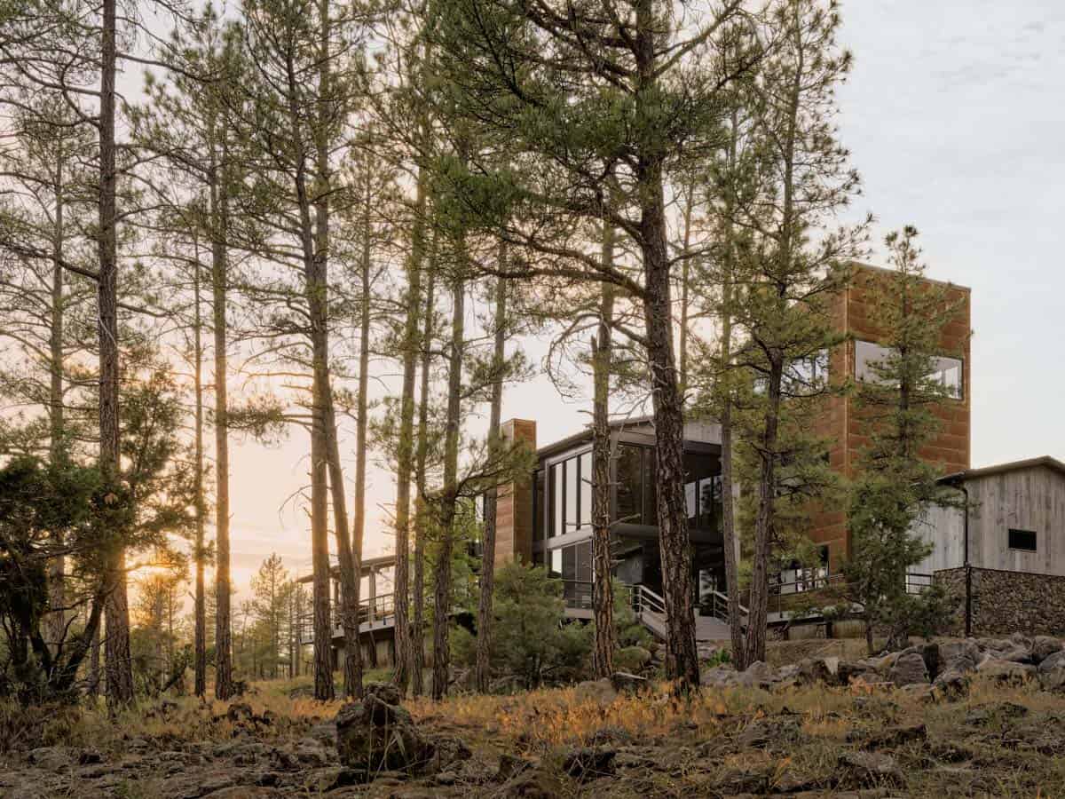 mountain modern house with a tower in a ponderosa forest
