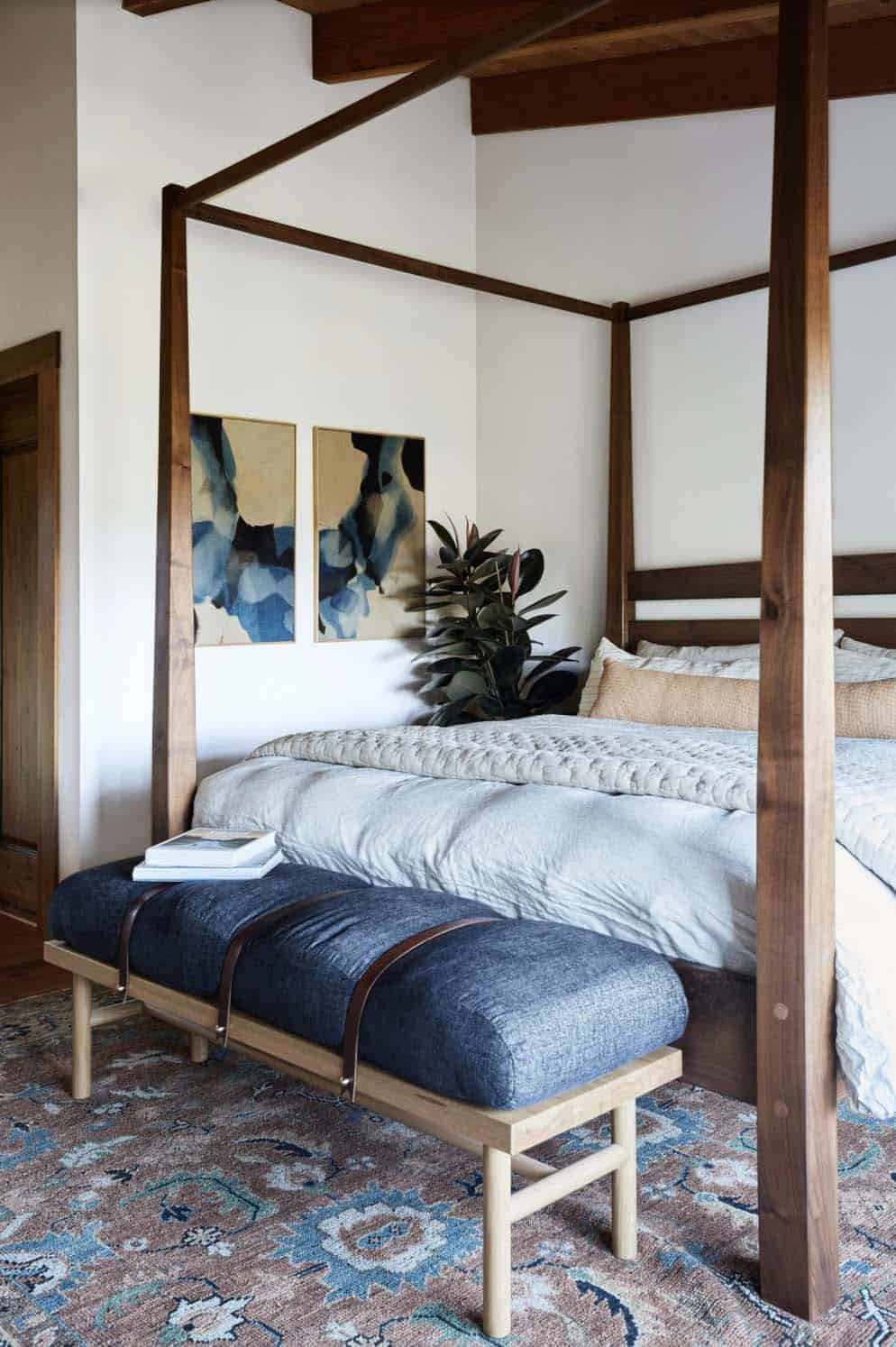 modern rustic bedroom with a canopy bed