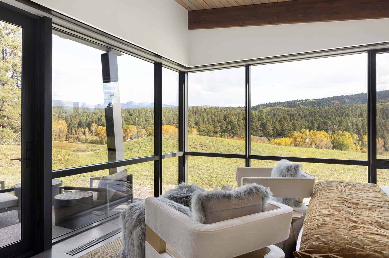 modern bedroom sitting area with views of the Colorado landscape