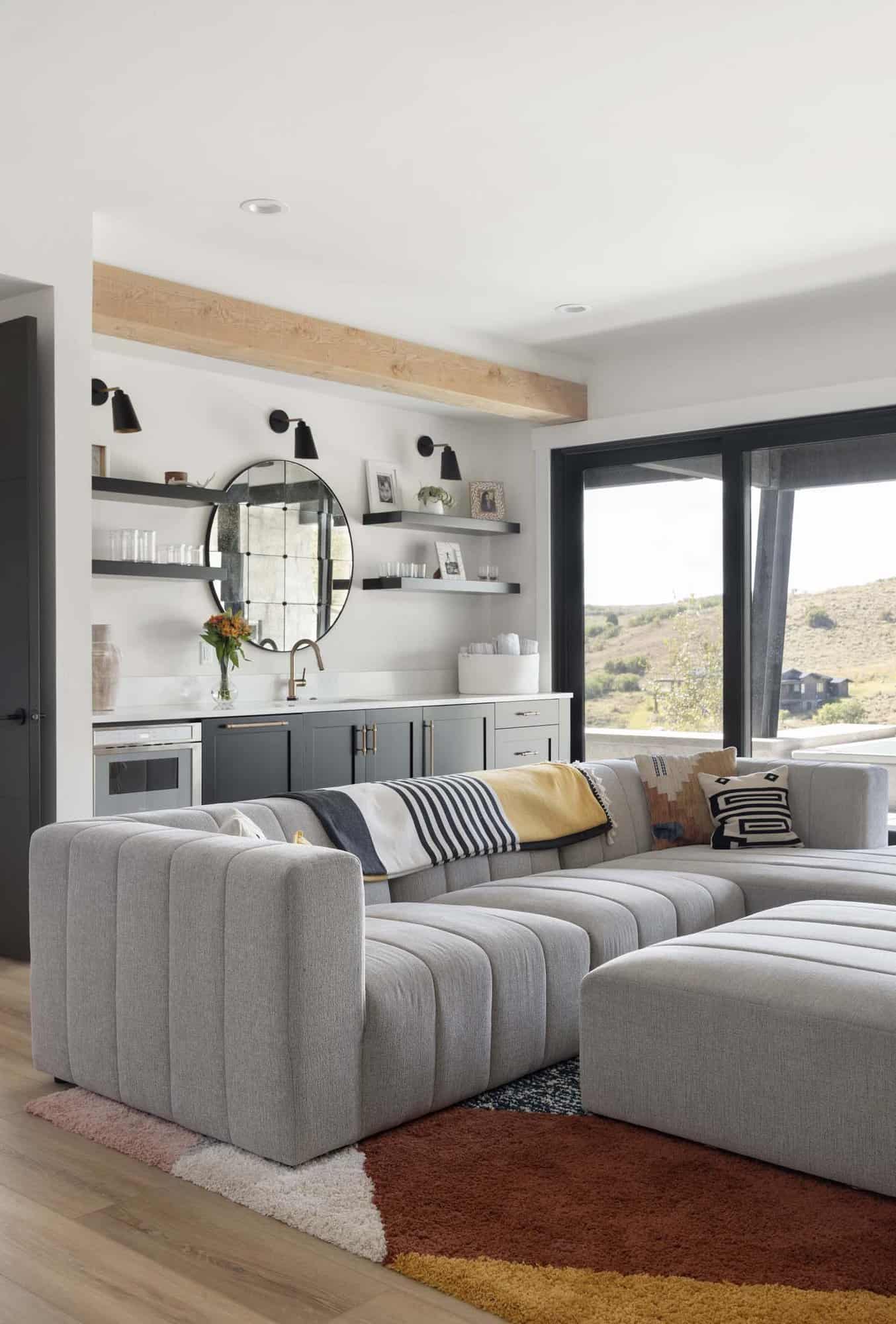modern mountain style family room with a kitchenette