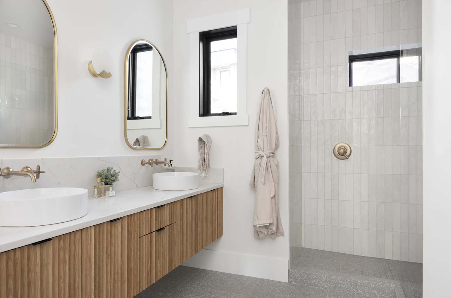 modern girl's teen bathroom with a vanity and walk-in shower