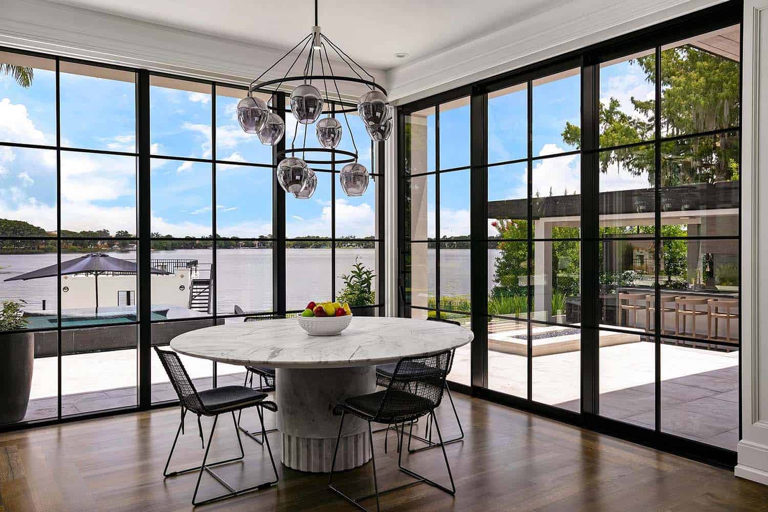 transitional style casual dining nook with floor-to-ceiling windows