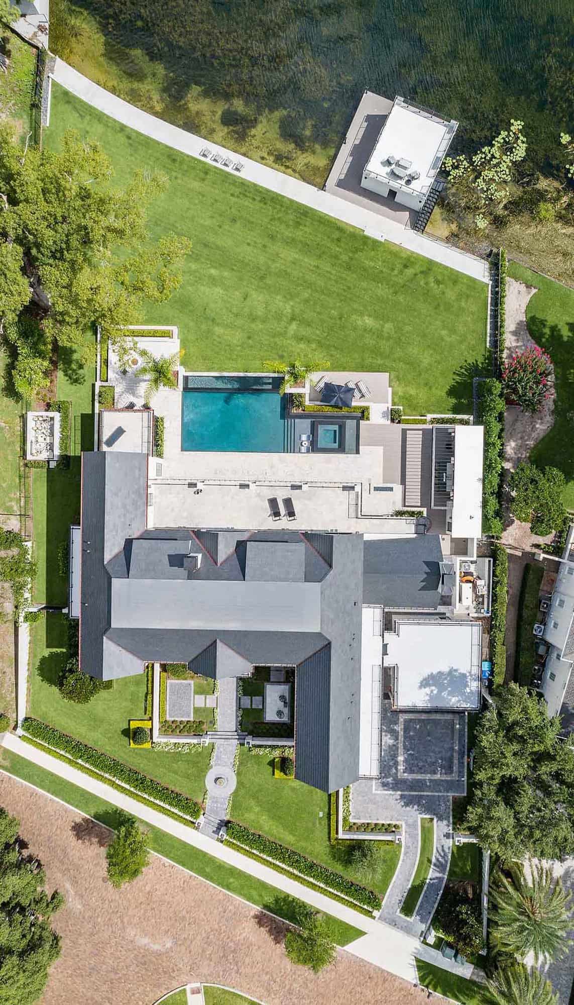 transitional style lake house aerial view