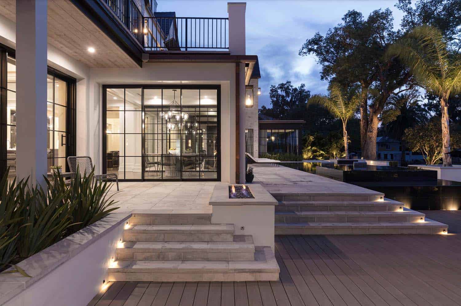 transitional style home exterior at dusk
