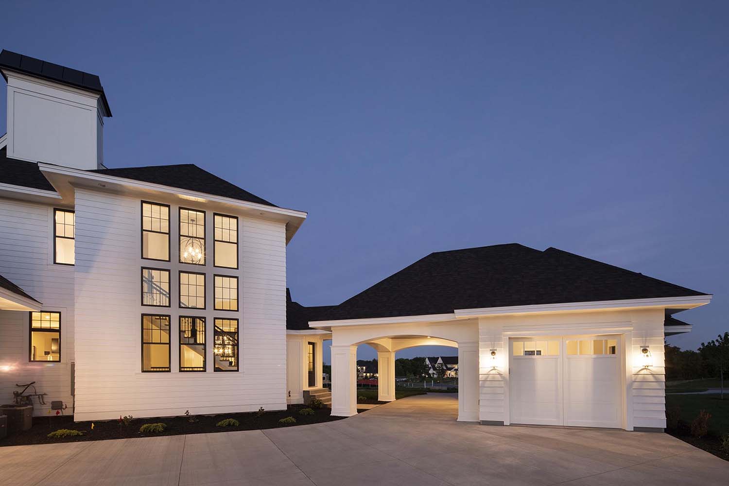 transitional style home exterior with a garage