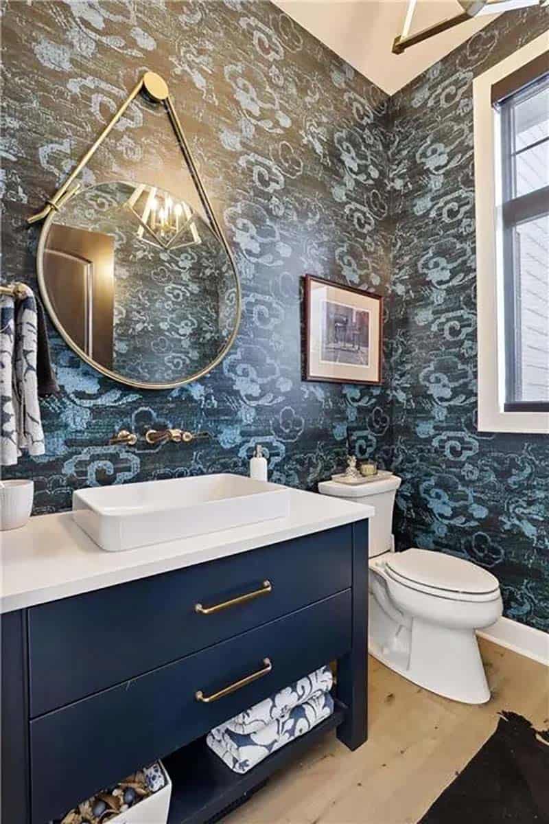 transitional style powder room with wallpaper