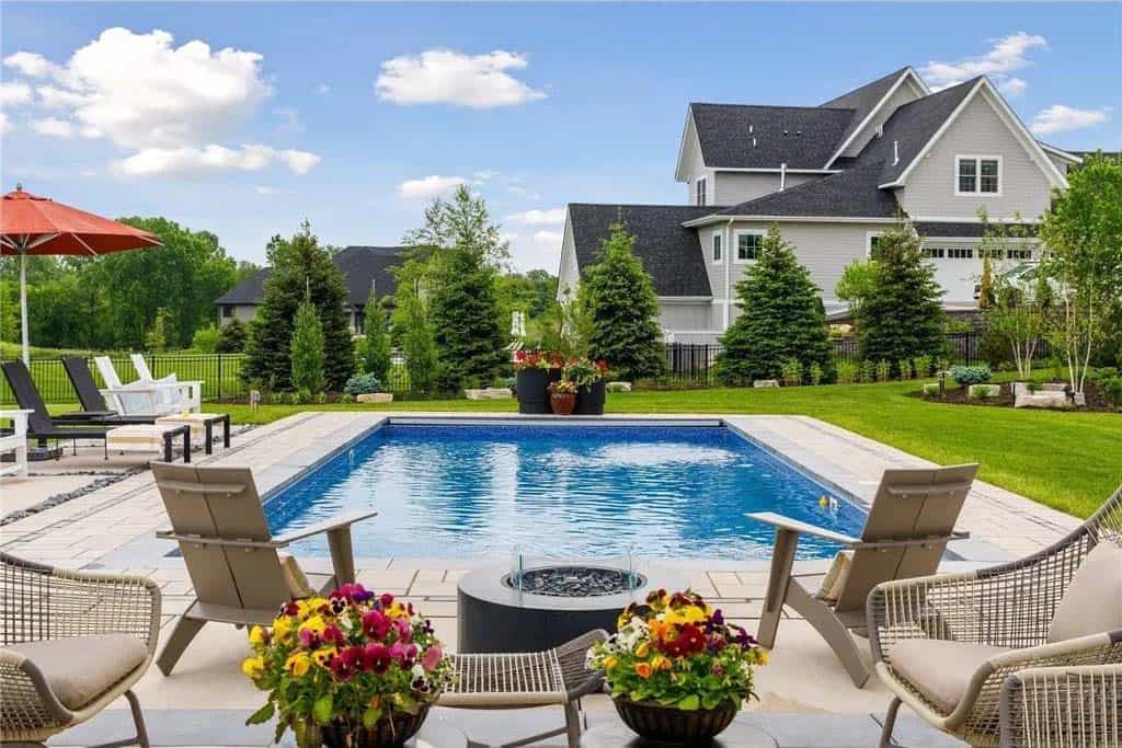 transitional style home exterior backyard with a pool 