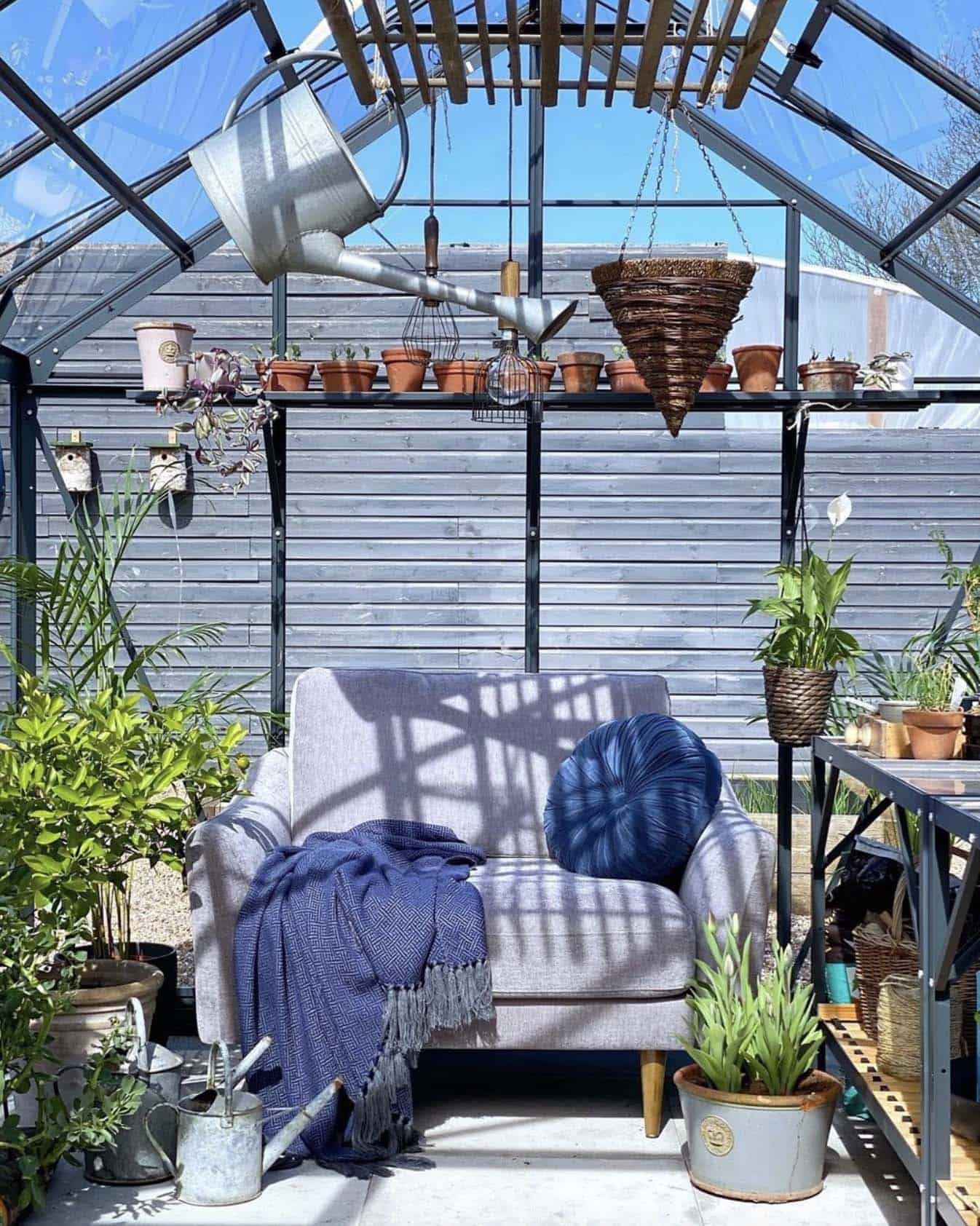 cozy greenhouse backyard shed with a sofa