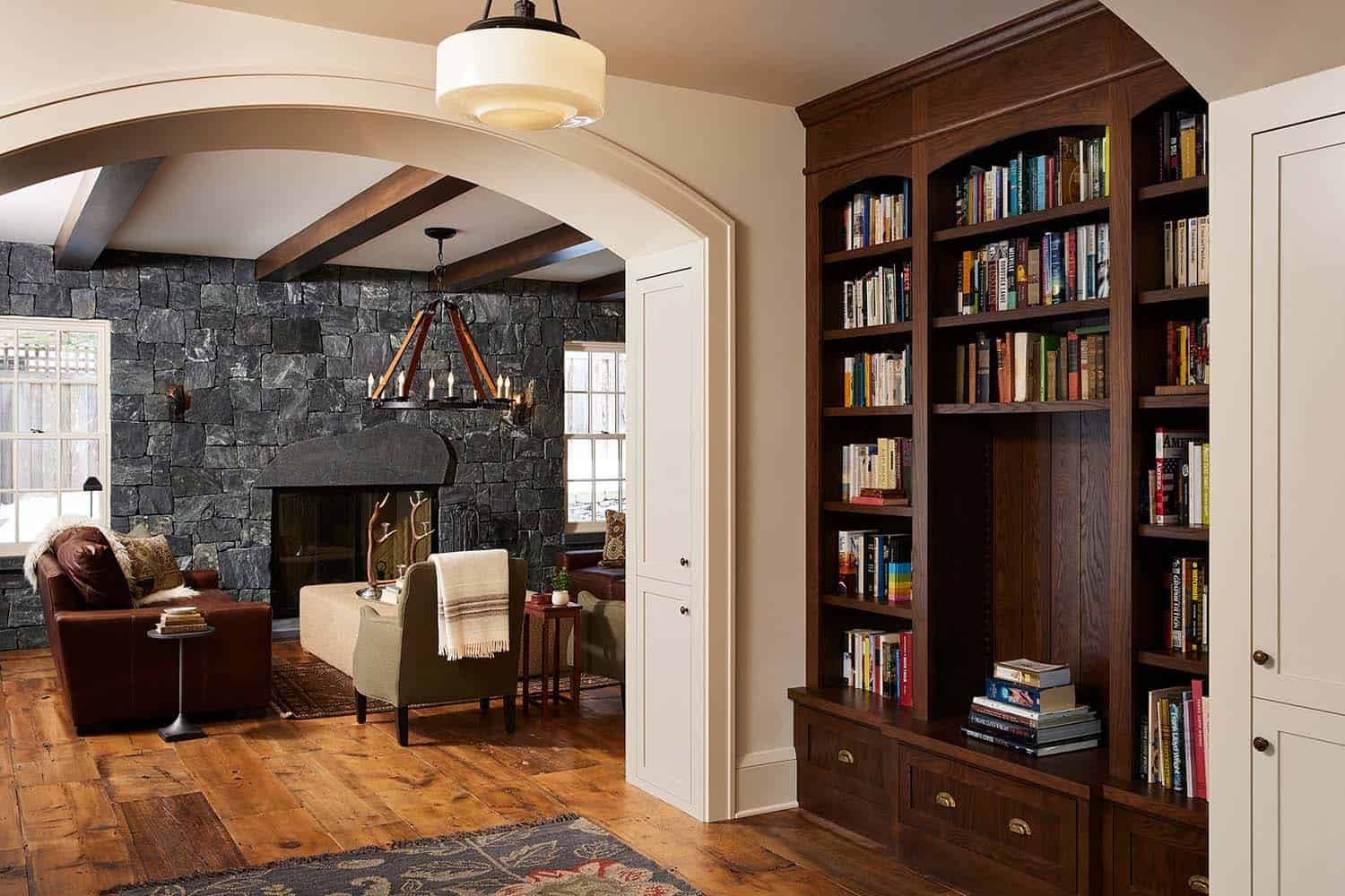 transitional hallway with a built-in bookcase