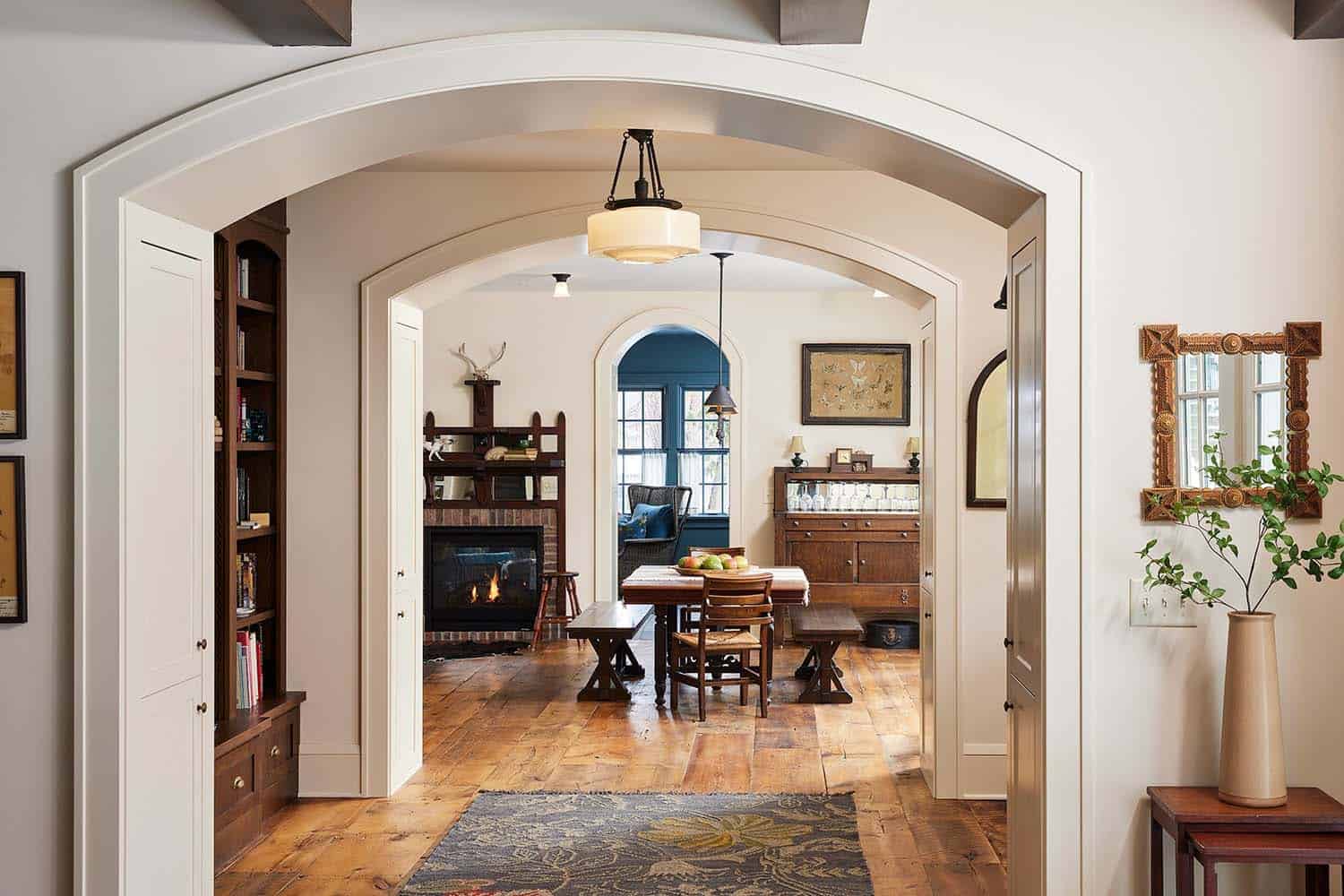 transitional hallway with an arched opening