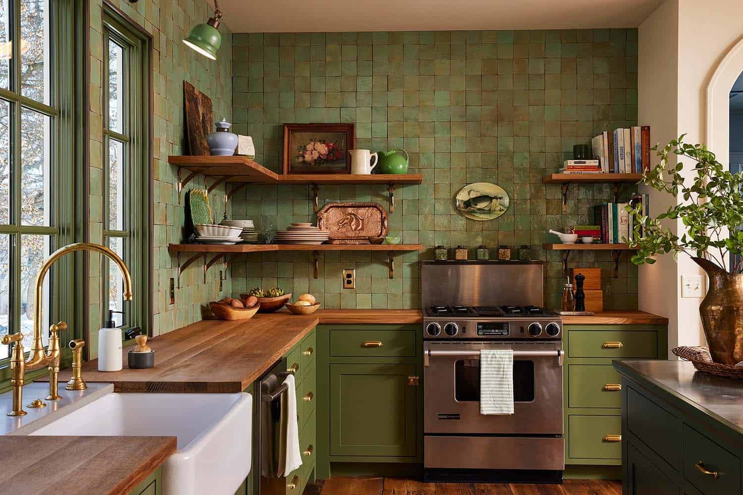 transitional kitchen with green tiles and wood countertops